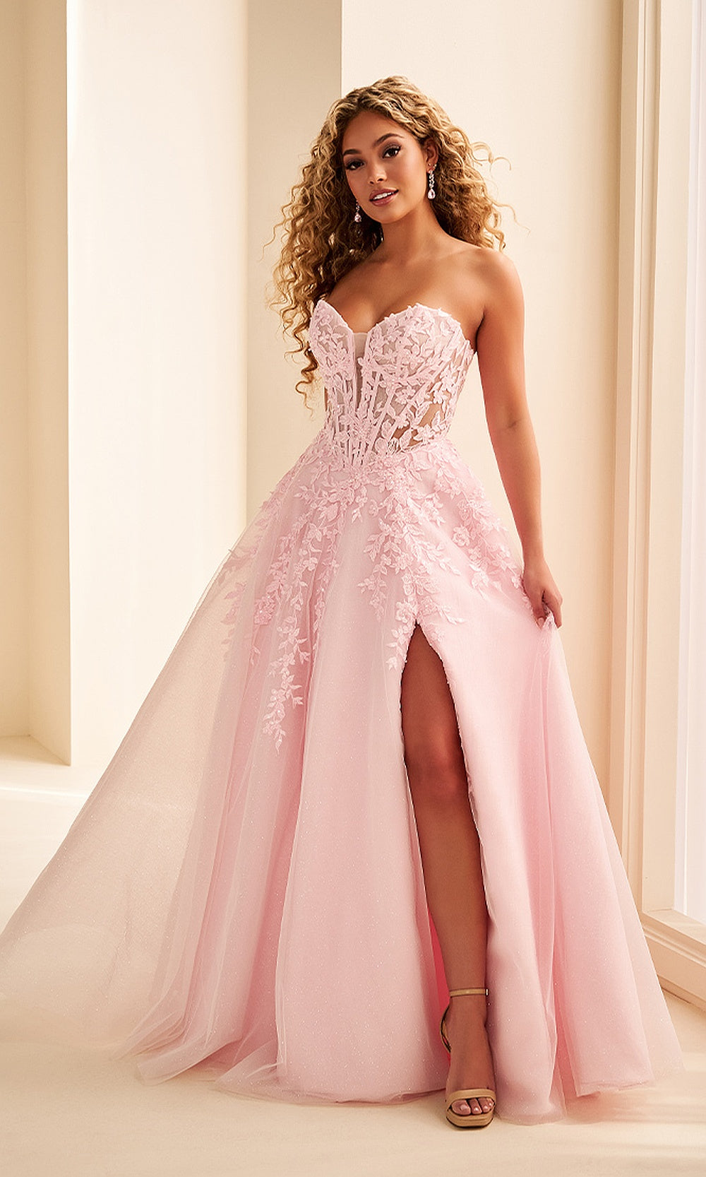 Ellie Wilde EW38221 Light Pink prom dress front view with tulle and lace, floral appliques and beading, strapless sweetheart corset ballgown silhouette, formal prom gown.