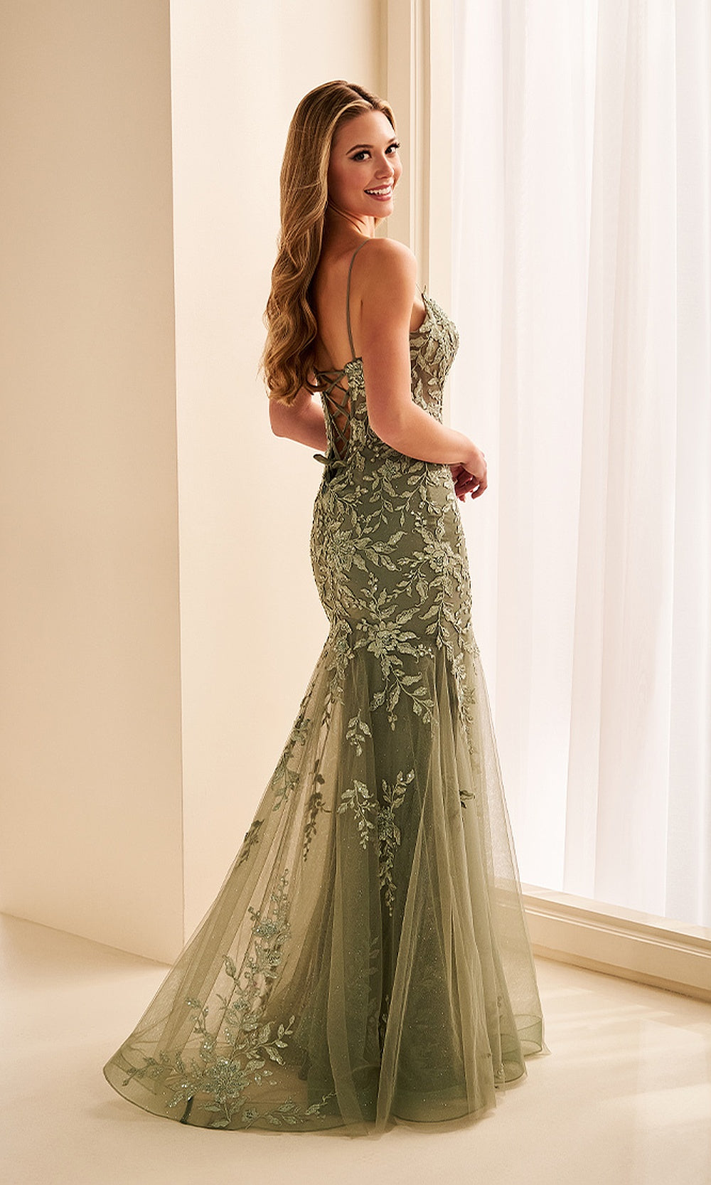 Ellie Wilde EW38223 Sage prom dress back view with lace appliqués, crisscross corset back with boning, fitted mermaid silhouette, evening gown.