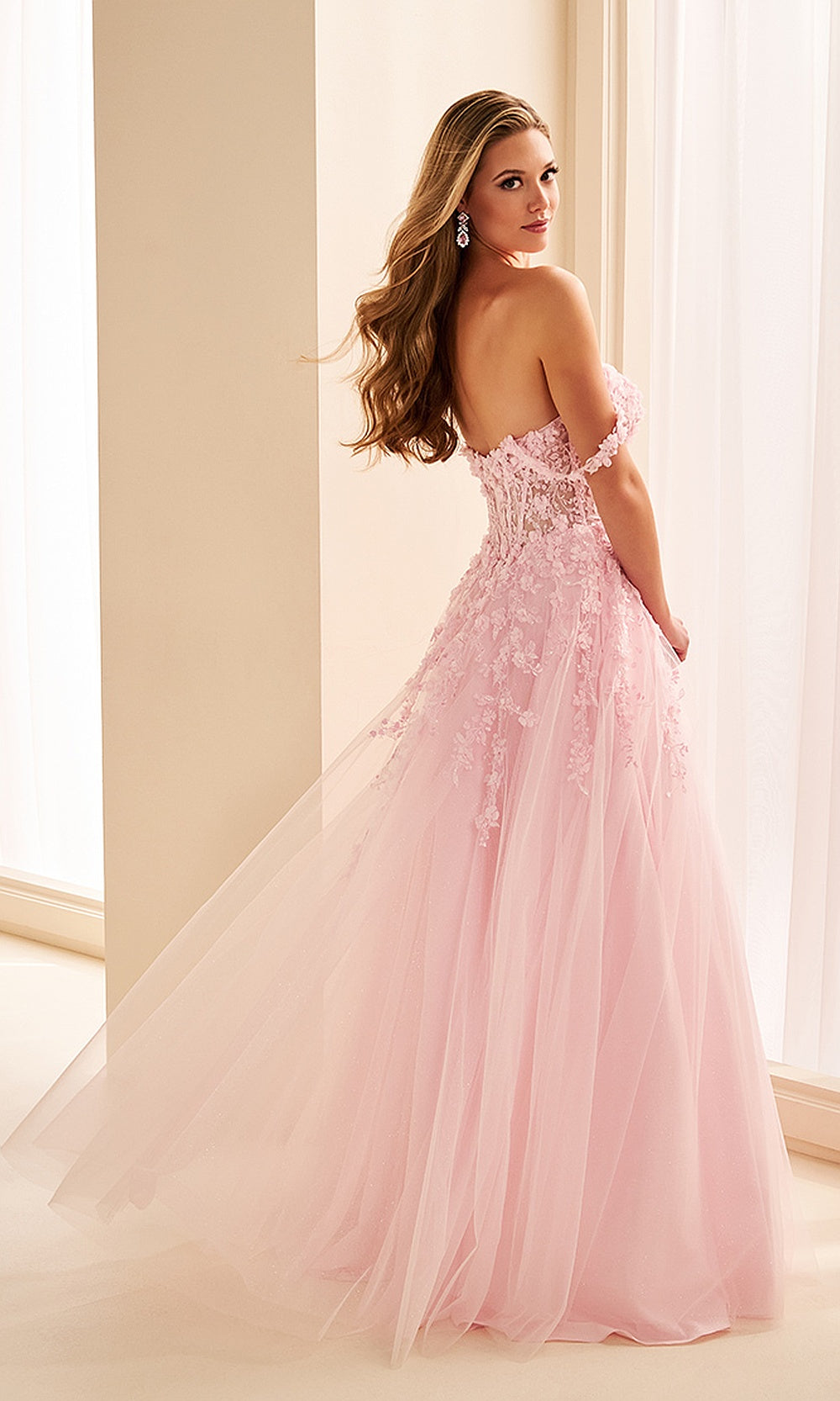 Ellie Wilde EW38224 Pink prom dress back view with lace and tulle, floral appliques, open-back corset ballgown silhouette, elegant gala gown with sweeping train.