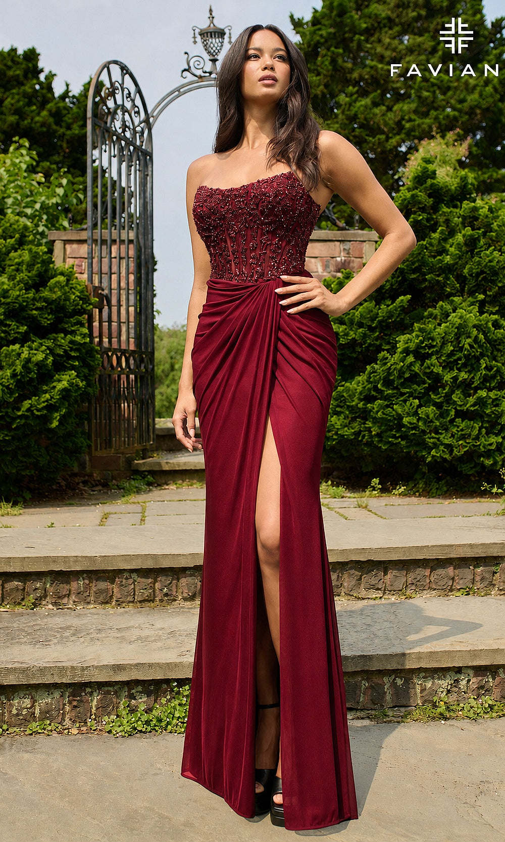 Faviana 11445 Merlot prom dress front view with beaded strapless corset bodice, draped jersey skirt, front high slit, fitted long silhouette, evening gown