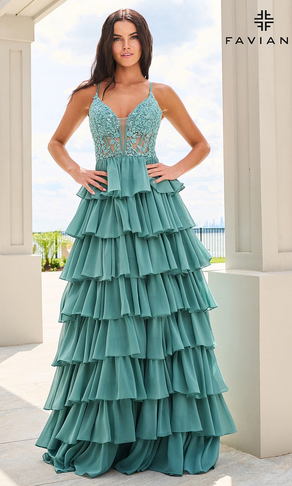Faviana 11603 Dark Pacific Blue prom dress on-model front view with floral lace bodice, beading, tiered chiffon ruffle skirt, V-neckline, spaghetti straps, formal prom gown