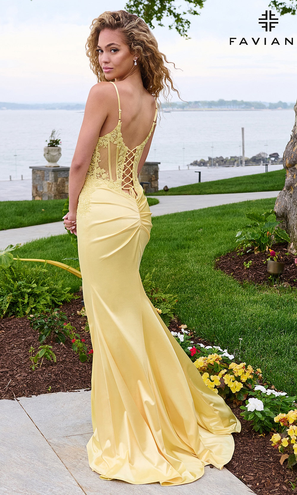 Faviana 11605 Light Yellow prom gown on-model back view showing full open crisscross lace-up back, floral appliqué bodice, sweep train, formal prom gown