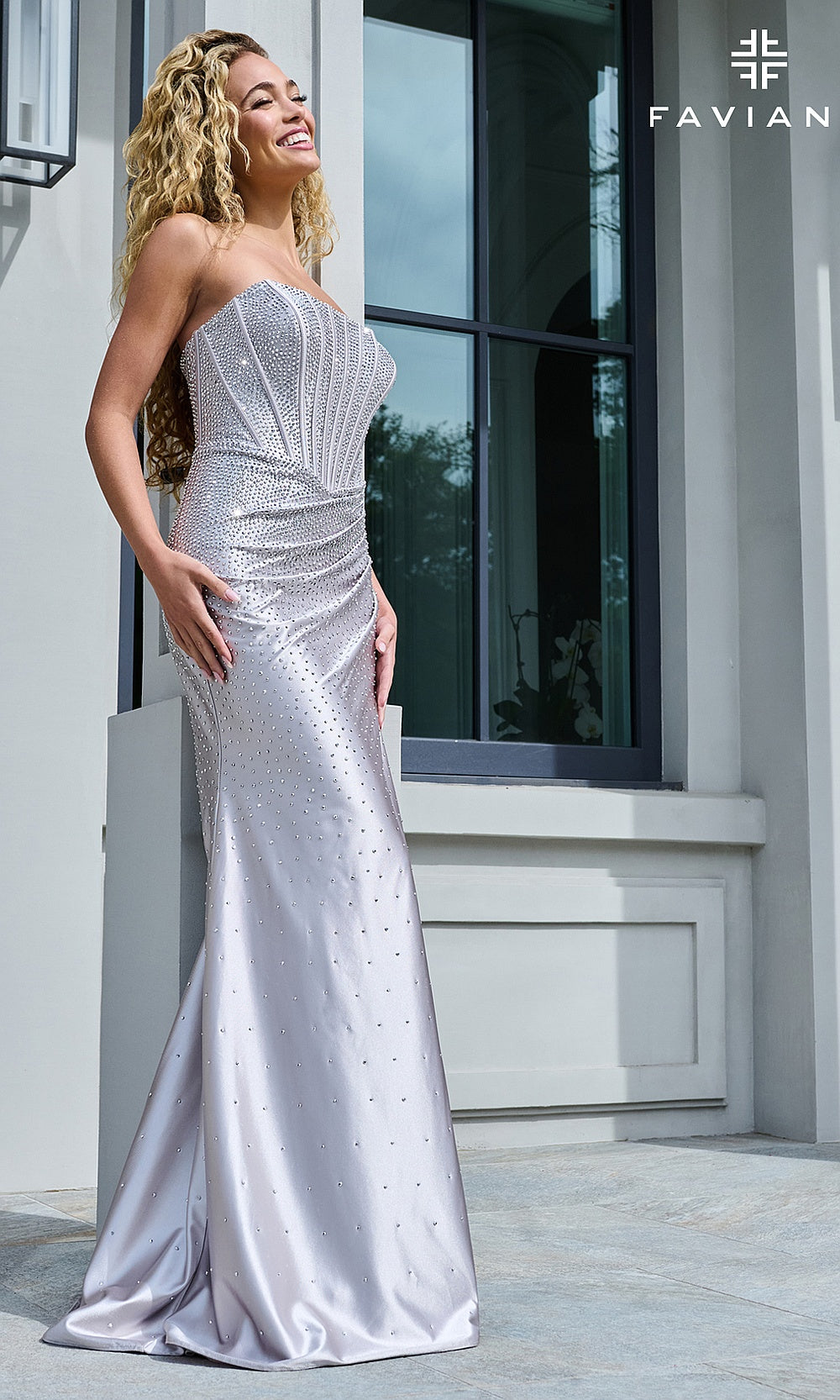 Faviana 11613 Silver side view showing ruched waist and fitted mermaid skirt in stretch satin with scattered hot-stone detailing, evening gown styled for prom