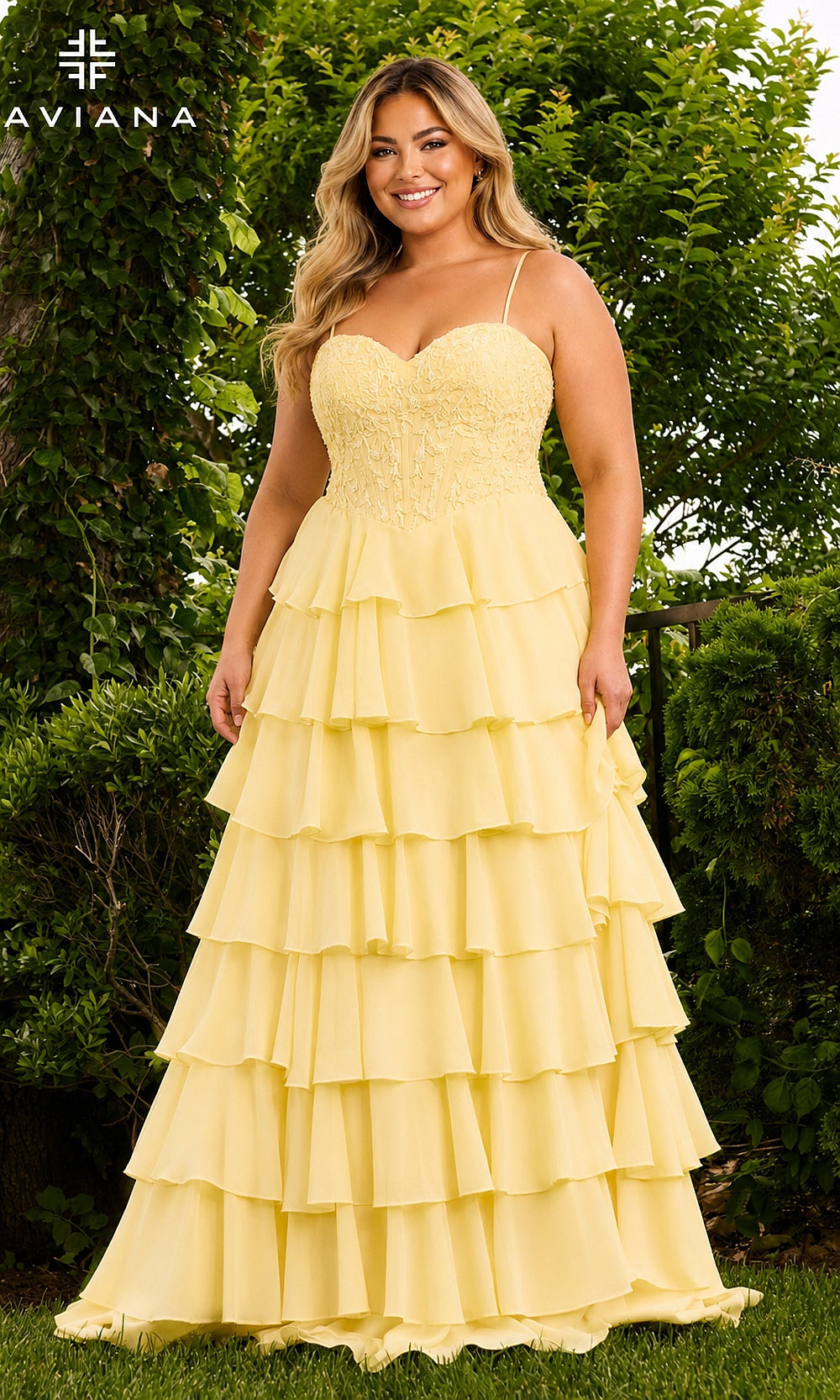 Faviana 11665E Light Yellow plus size prom gown front view, lace sweetheart corset bodice with floral appliqués and tiered ruffle chiffon A-line skirt
