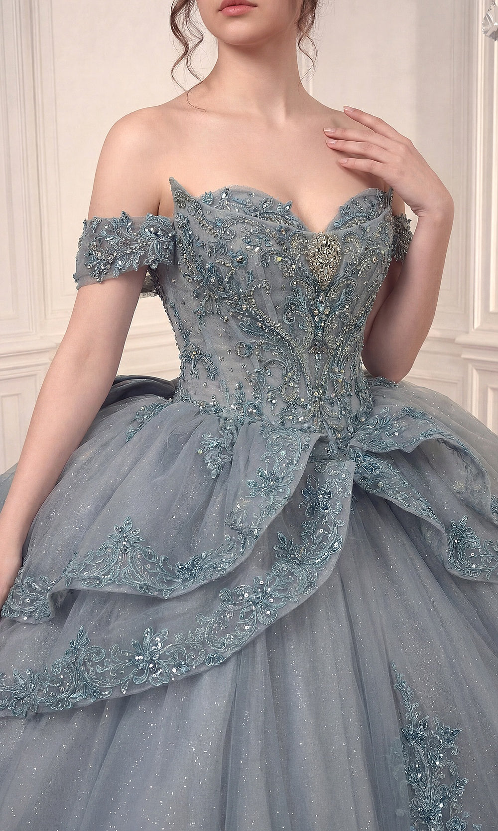 Ladivine 15729 Dusty Blue detail view, rhinestone beading and floral lace appliqués on bodice, quinceañera gown embellishment close-up