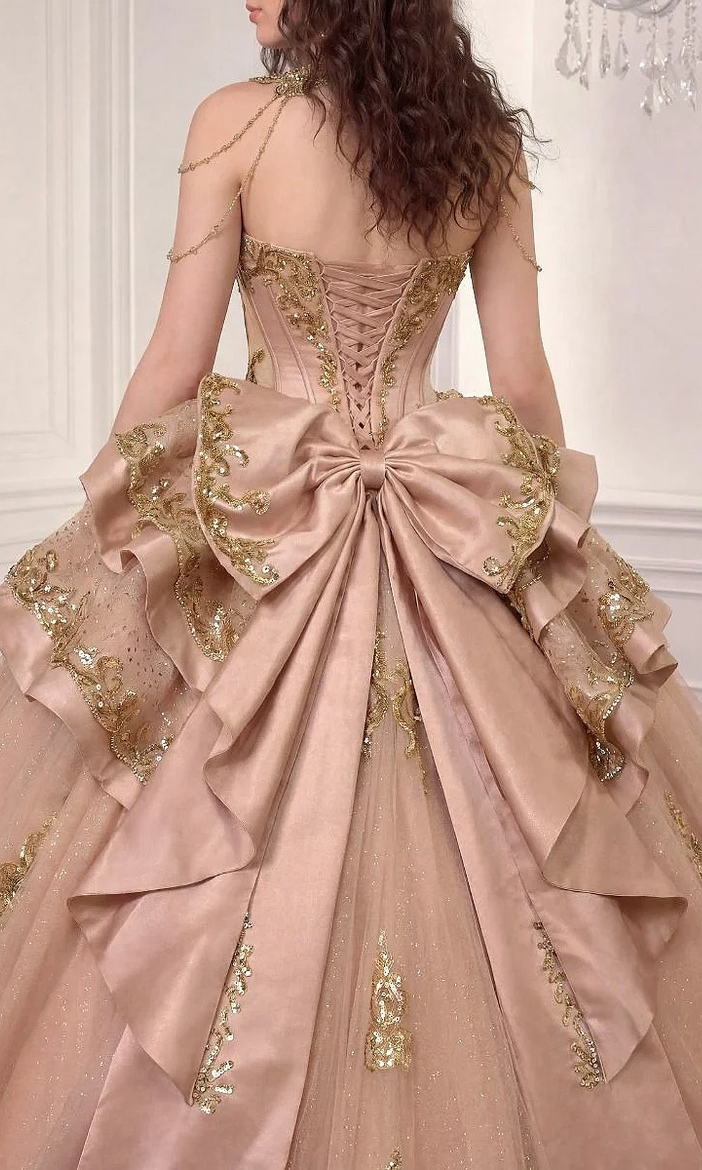 Ladivine 15744 Rose Gold back-detail view of corset lace-up closure and tiered overskirt bow bustle in glitter tulle, debut ball gown made for quinceanera nights