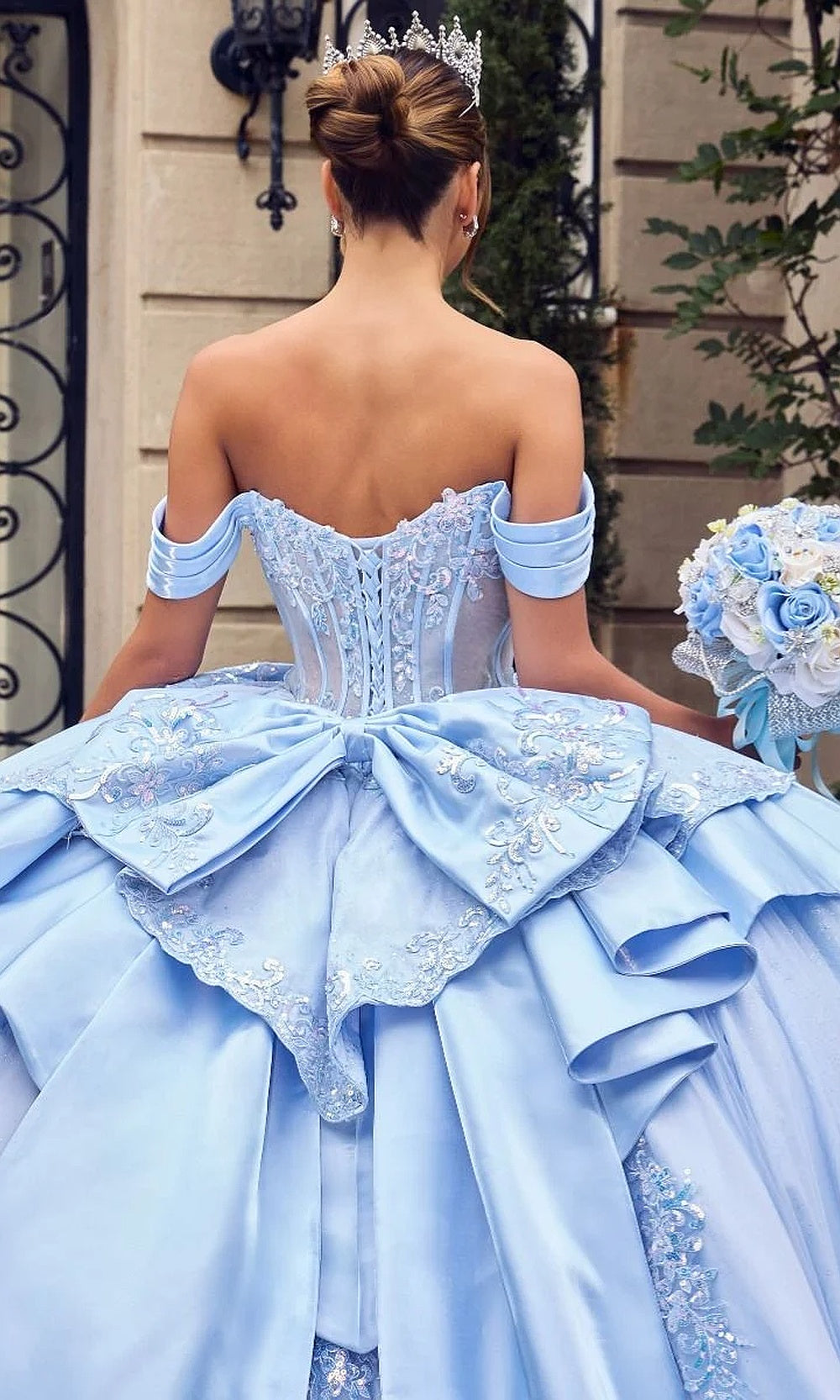 Ladivine 15745 Light Blue back view quinceañera ballgown with corset lace-up closure, glitter tulle skirt, dramatic cathedral-length train, debut ball gown