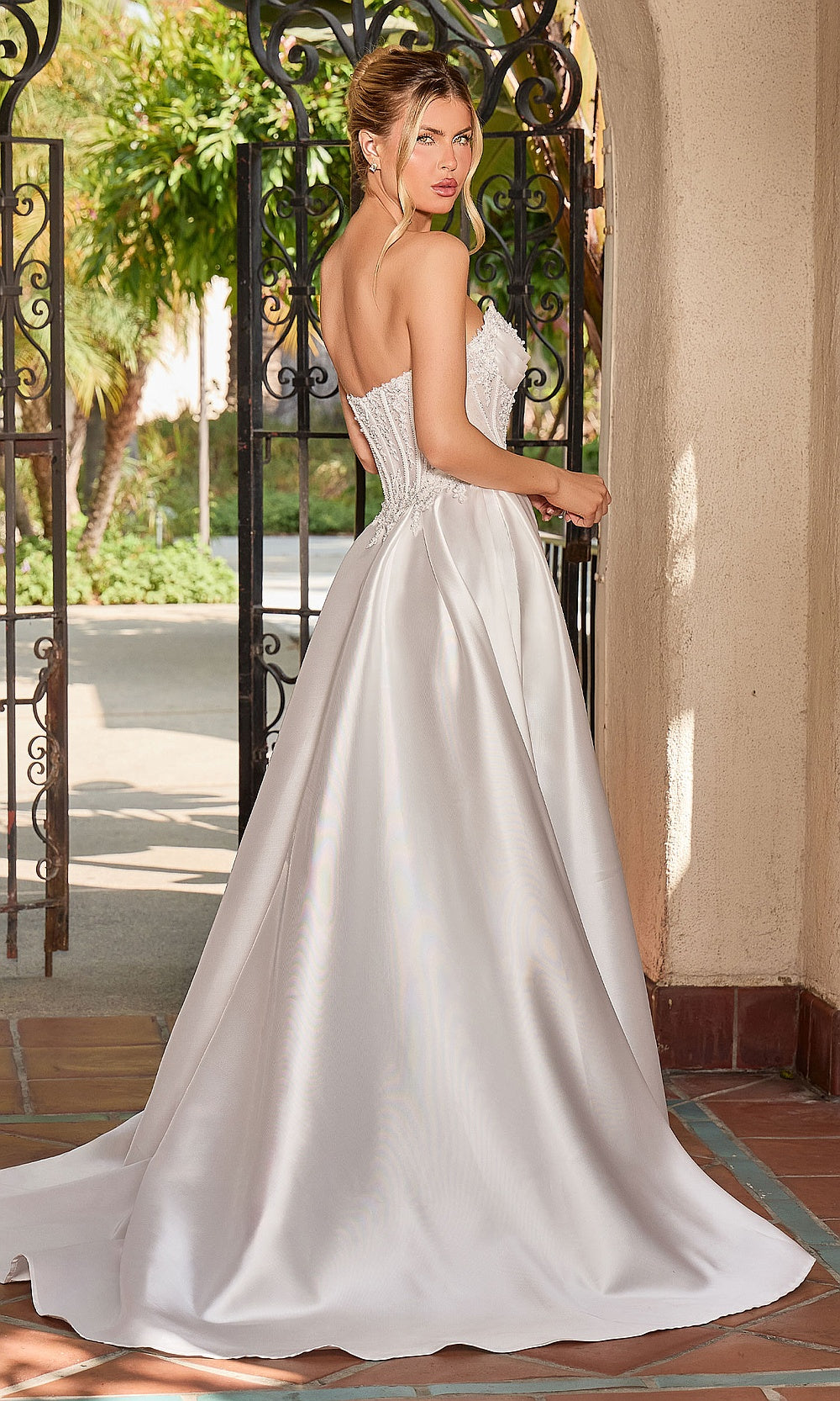 Ladivine CC511W off-white corset-back ballgown with chapel train and structured illusion corset bodice, back view, bridal gown for formal wedding celebration