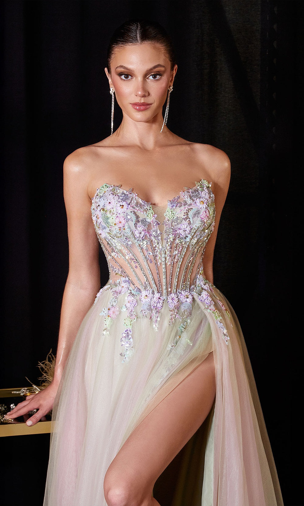Ladivine CD2418 sage detail view showing sheer illusion corset bodice with boning channels, 3D floral appliqués and beading, strapless sweetheart neckline, red carpet styling, a prom favorite