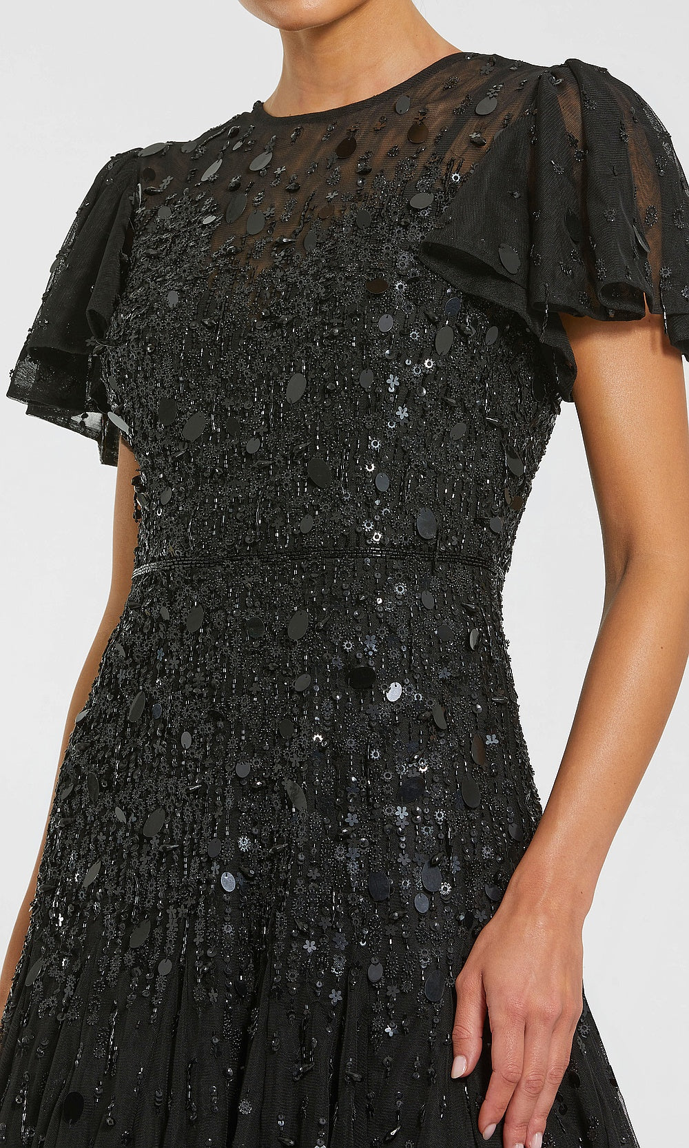Mac Duggal 24018 black detail view formal gown showing paillette sequin beaded fringe floral applique embellishment fully beaded flutter sleeve black-tie event dress