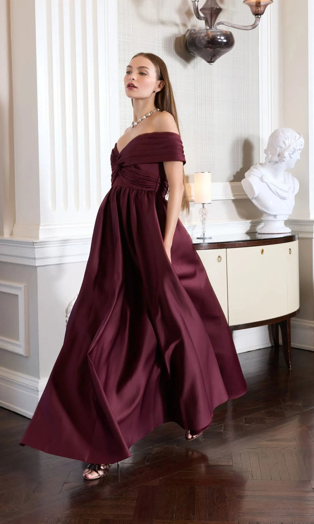 Mac Duggal 56188 wine side view off-shoulder satin ballgown with twisted knot bodice, empire waist, and sweeping A-line skirt with train, formal evening gown