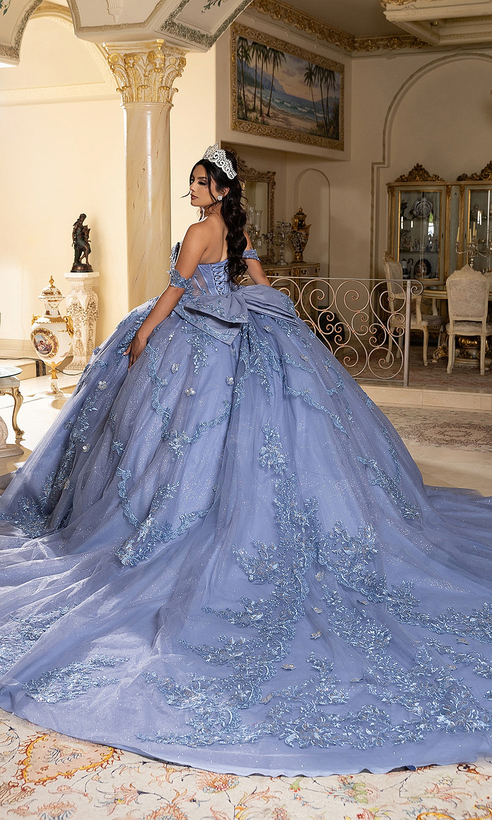 May Queen LK283 dusty blue quinceañera ball gown — back view of the corset back, bow, and glitter train