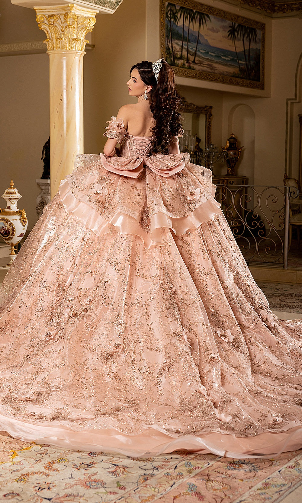 May Queen LK295 rose gold quinceañera ball gown — back view of the tiered ruffle skirt and long train