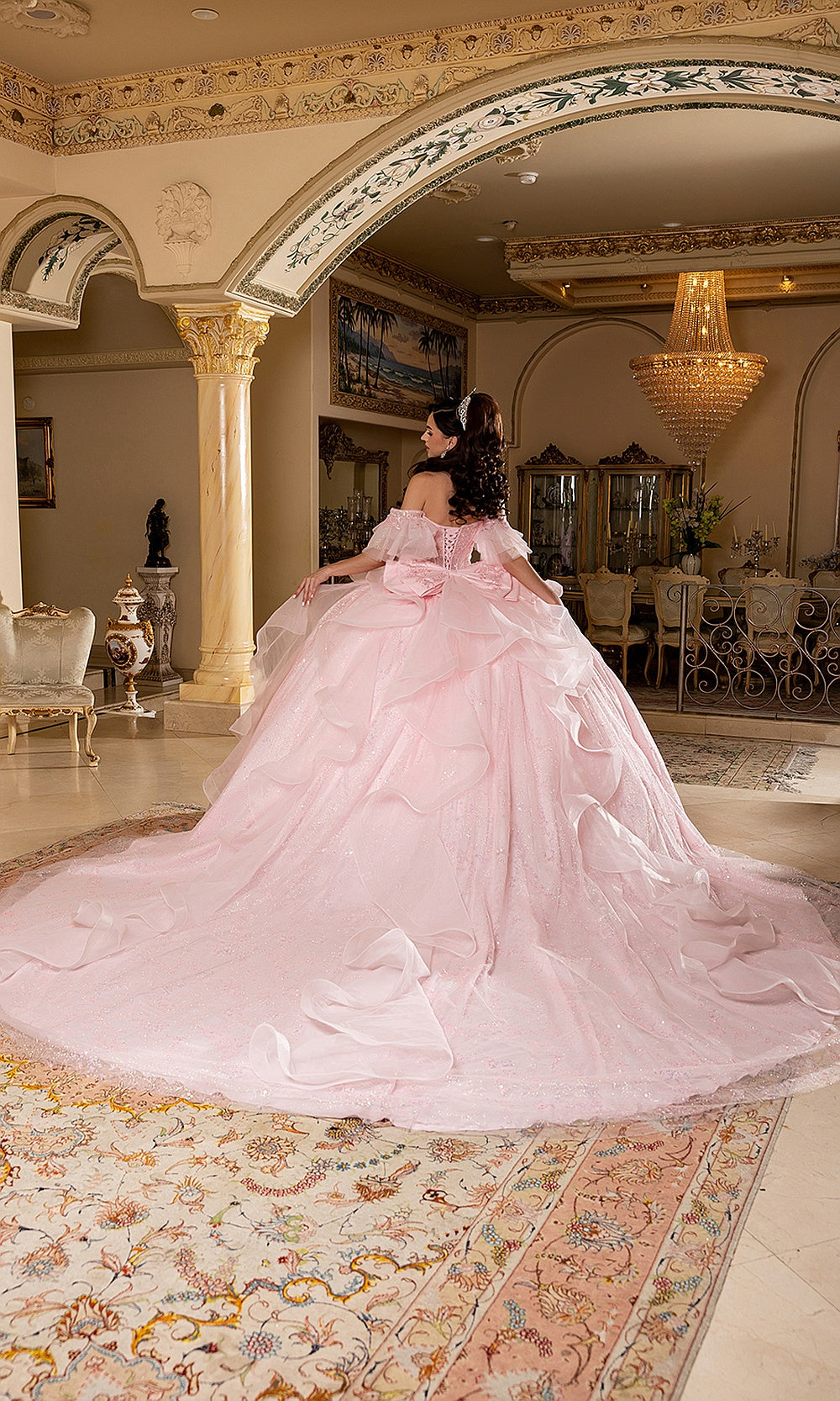 May Queen LK296 blush pink quinceañera ball gown — back view of the tiered ruffle skirt and long train