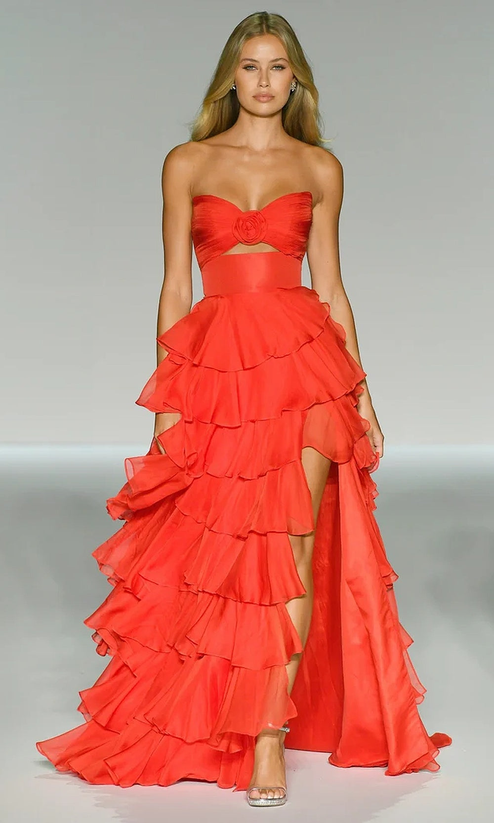 Sherri Hill 56870 Red prom gown with sweetheart neckline, fabric floral rosette bodice, midriff cut-out, tiered chiffon ruffle skirt, formal prom gown