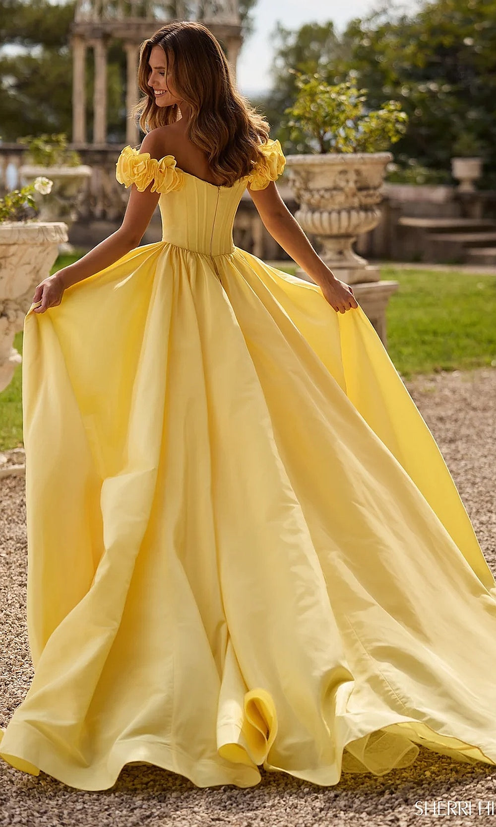 Sherri Hill 57200 Yellow prom gown back view with high-back covered bodice closure, floor-length chiffon organza train overskirt, formal evening gown