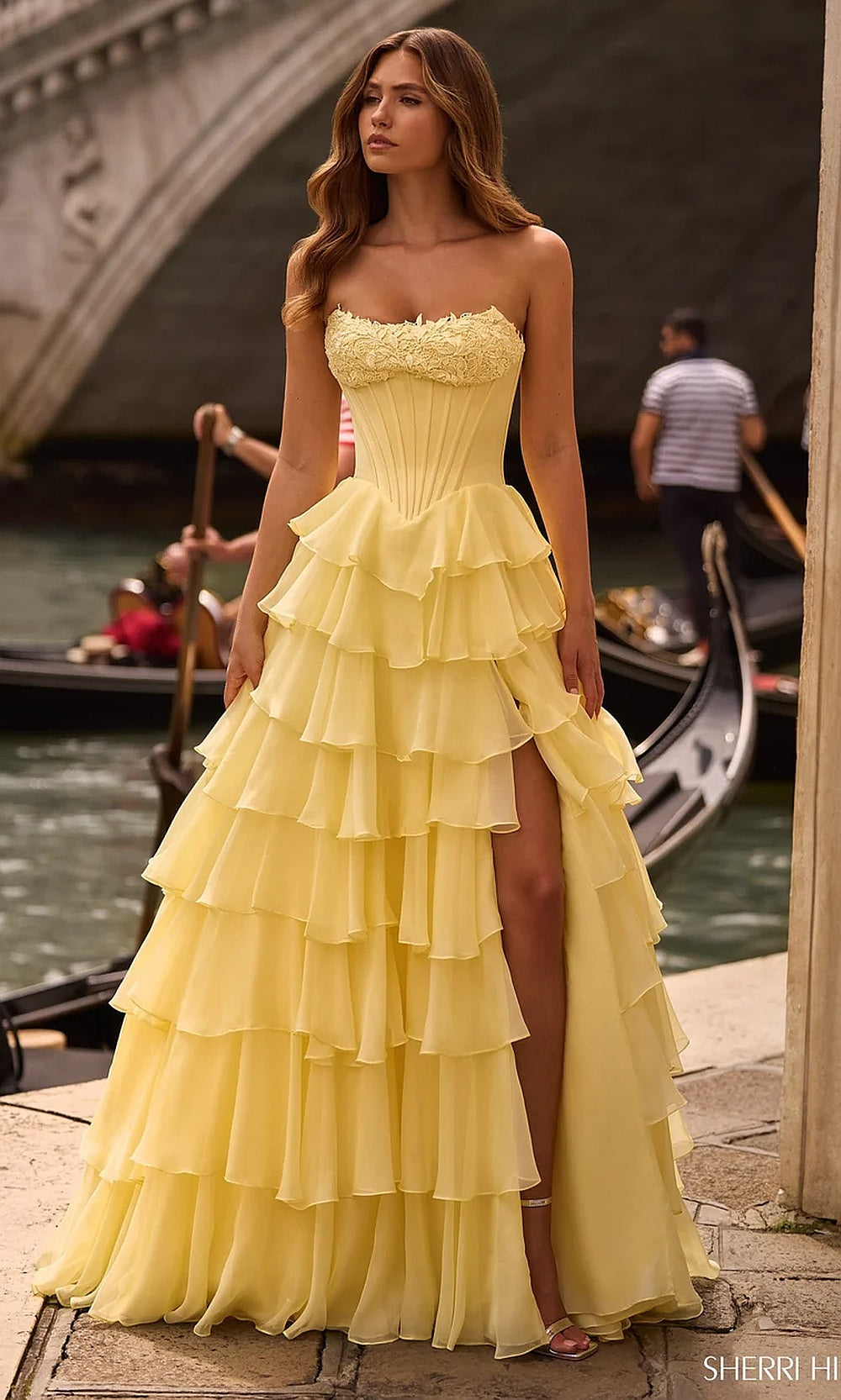Sherri Hill 57541 Yellow prom dress full view strapless chiffon ballgown with 3D floral trim multi-layer ruffle skirt and front slit red carpet styling