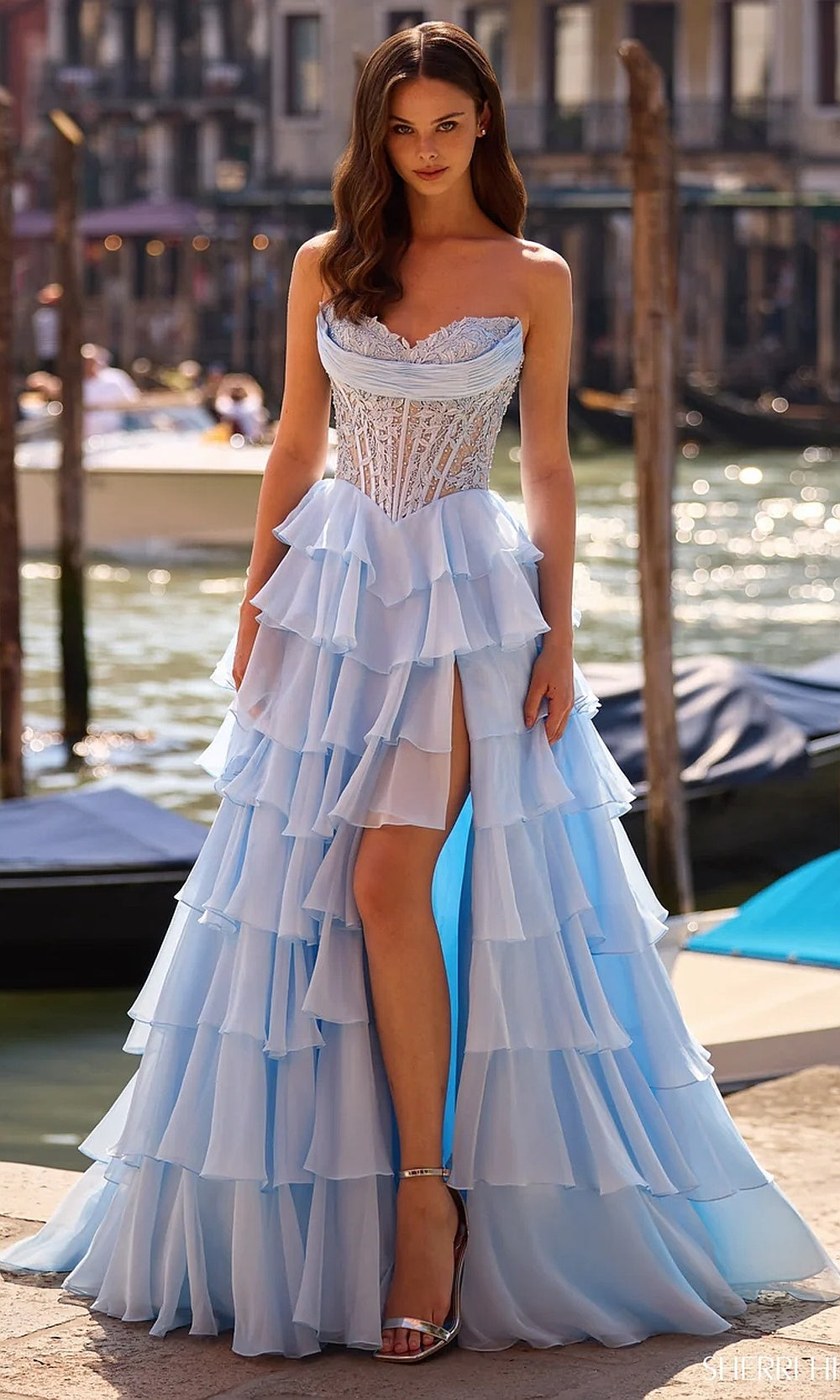 Sherri Hill 57542 Light Blue prom dress front view with chiffon tiered ruffles, lace illusion corset bodice, strapless sweetheart neckline, high front slit, formal prom gown