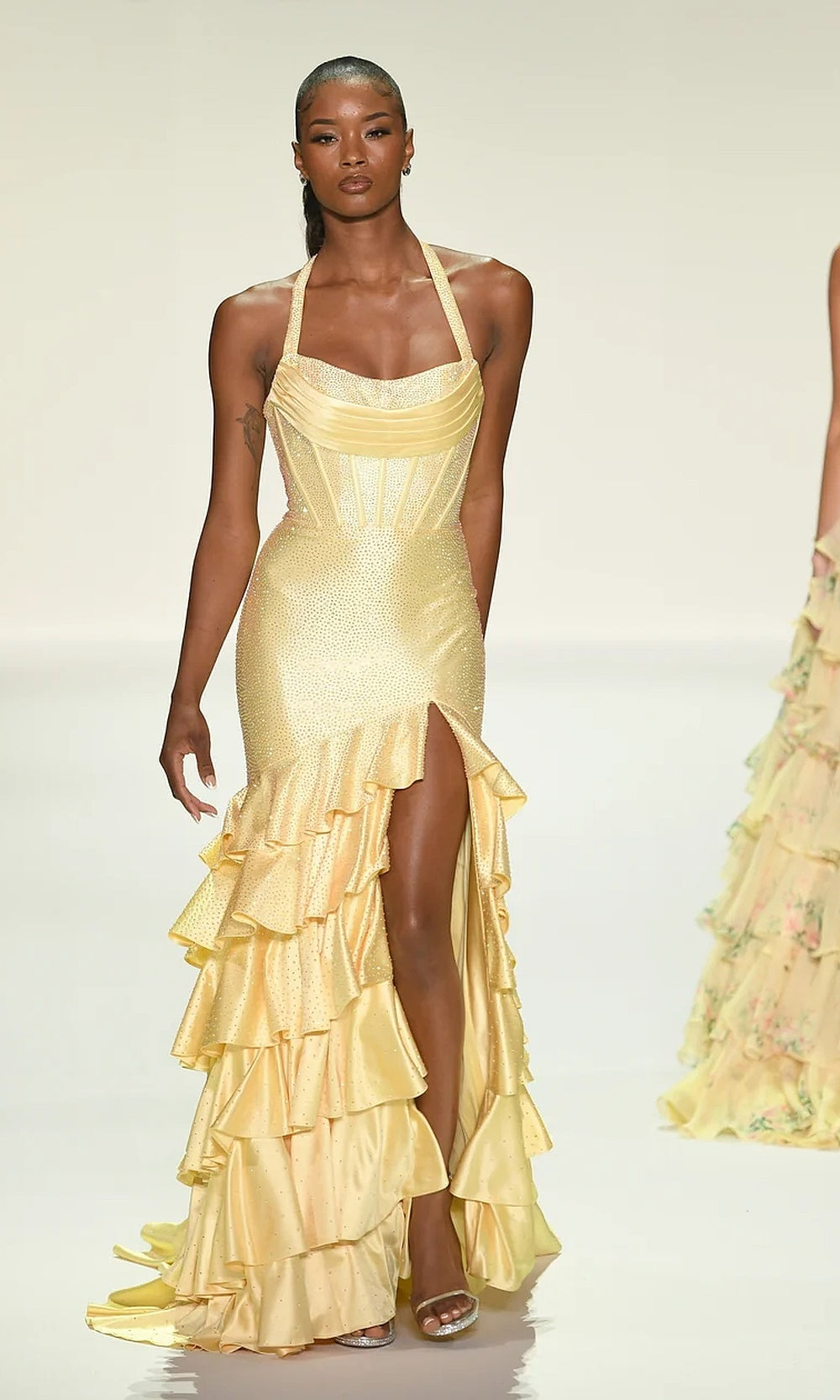 Sherri Hill 57618 Yellow prom dress editorial view, all-over rhinestone hot-stone fitted halter gown with dramatic tiered ruffle skirt, formal prom gown