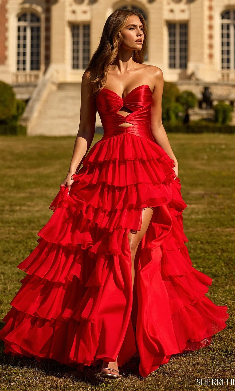 Sherri Hill 57705 Red prom dress front view with chiffon tiered ruffle skirt, strapless sweetheart satin bodice, midriff cutouts, formal prom gown