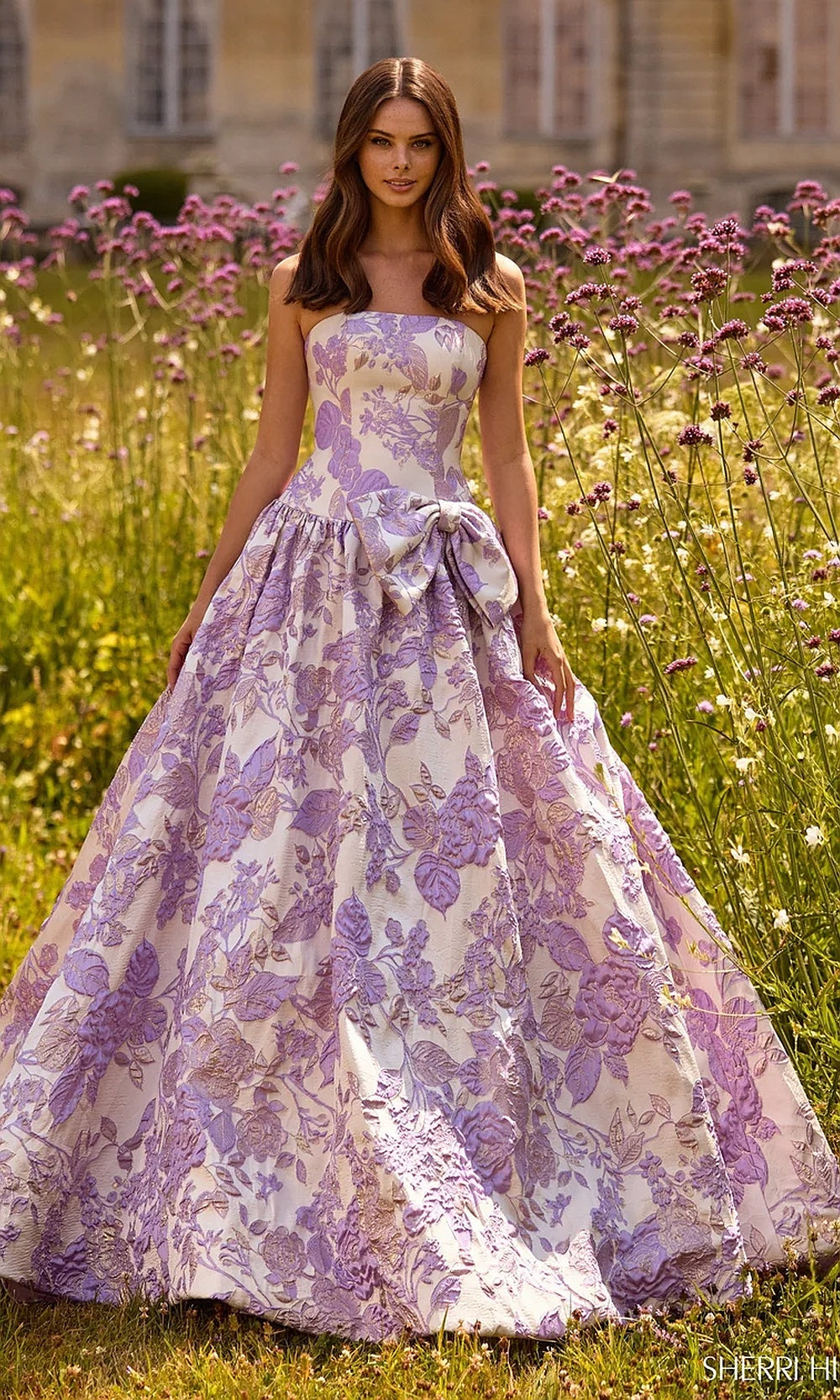 Sherri Hill 57730 Ivory Lilac floral jacquard strapless ballgown prom dress with waist bow, a-line skirt and train, front view, formal prom gown