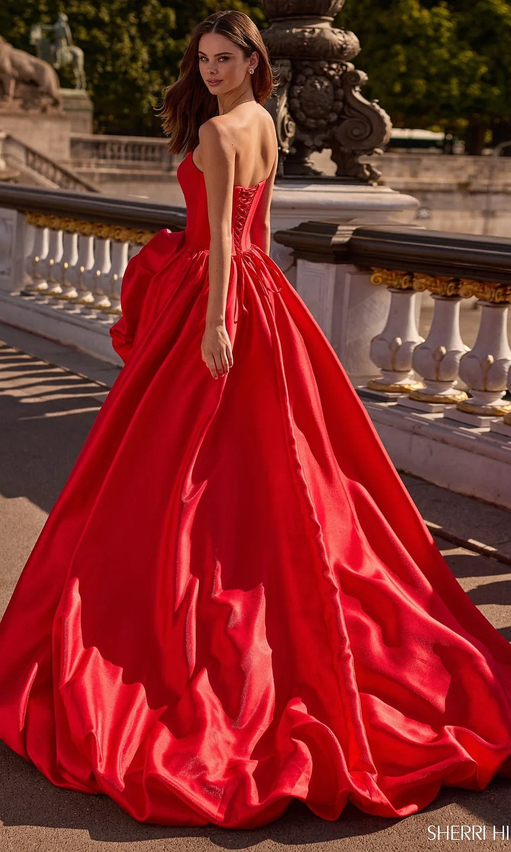 Sherri Hill 57778 Red prom dress back view lace-up corset-back closure on full ballgown with cathedral train evening gown