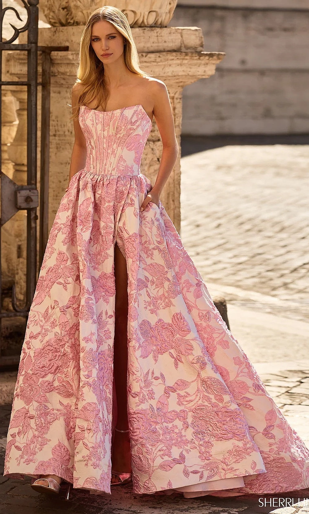 Sherri Hill 57912 Pink prom gown full view with raised floral glitter skirt, front high slit, sweep train, pageant ball gown