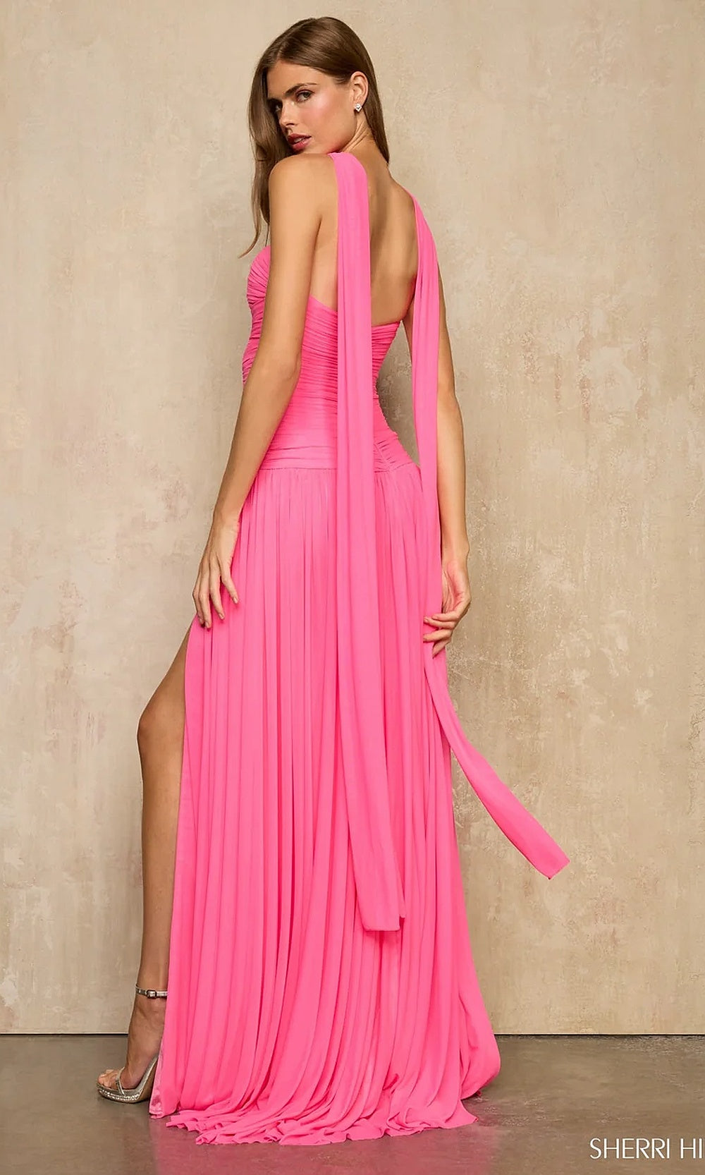 Sherri Hill 57951 Bright Pink prom gown showing fully open back and trailing halter panel, chiffon a-line silhouette, back view, evening gown for formal events