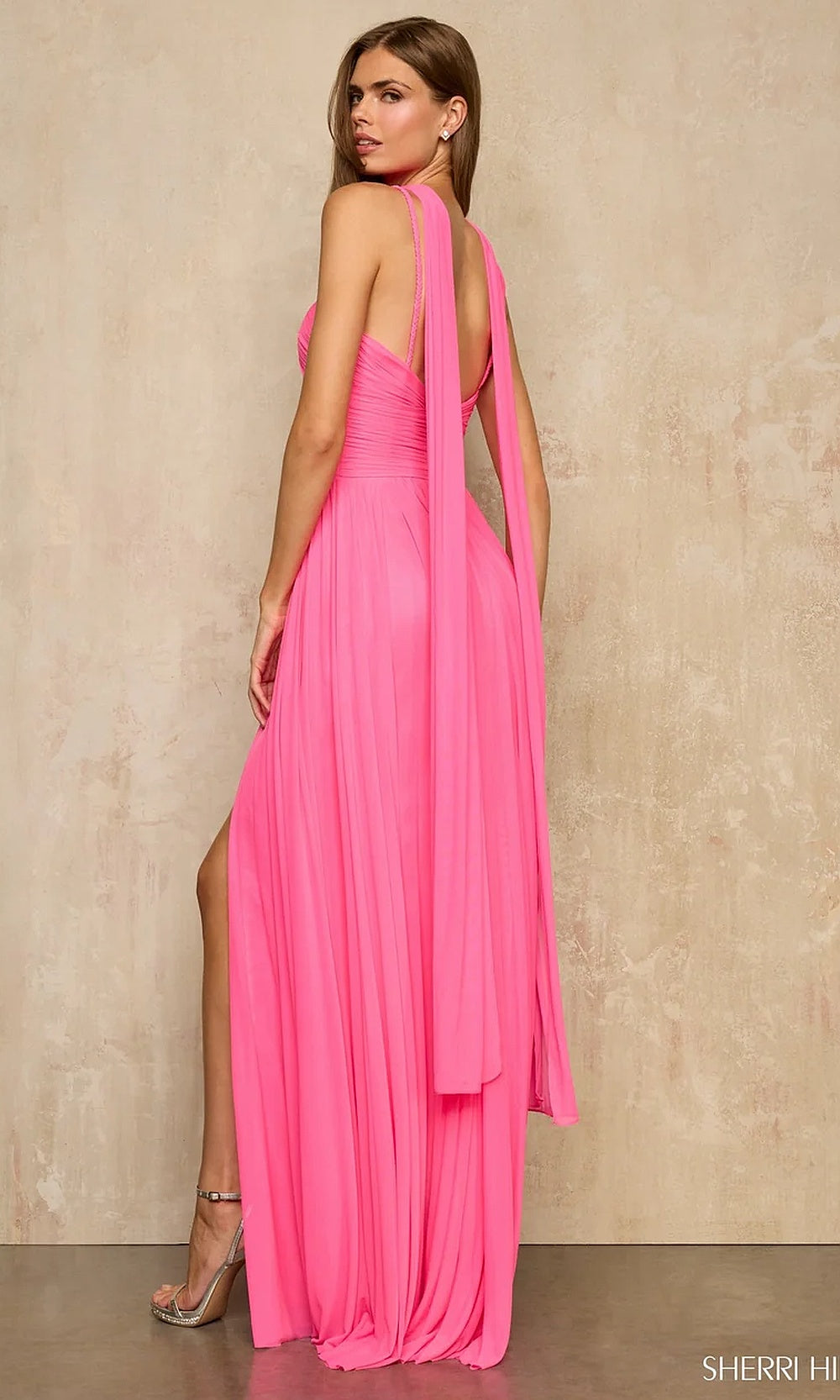 Sherri Hill 57970 Bright Pink prom halter chiffon a-line gown with fully open back and draped trailing halter panel, back view, evening gown