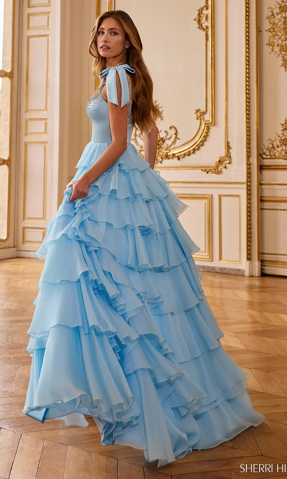 Sherri Hill 58041 Light Blue prom dress side view with full multi-tiered chiffon ballgown skirt, structured bodice, sweeping train, evening gown