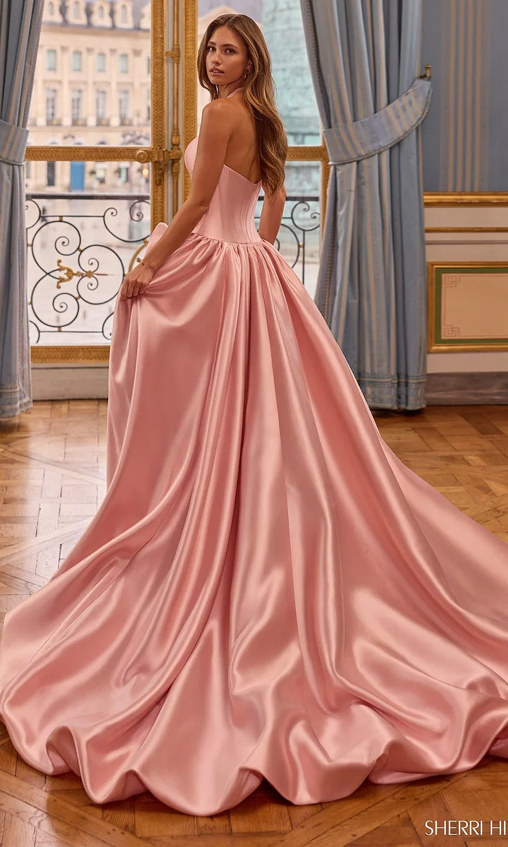 Sherri Hill 58162 Blush prom ballgown with open back and sweeping train, full back view, evening gown, elegant floor-length silhouette photographed in boutique studio lighting