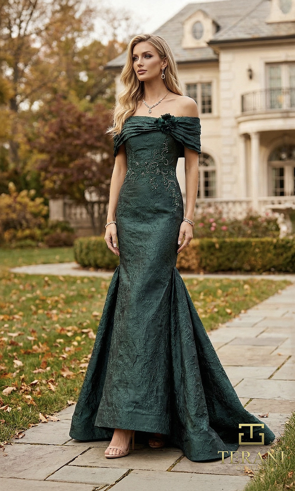 Terani Couture 262E7069 Hunter formal evening dress front view with off-shoulder ruched neckline with rosette, textured jacquard fitted mermaid, sweep train, black tie event dress