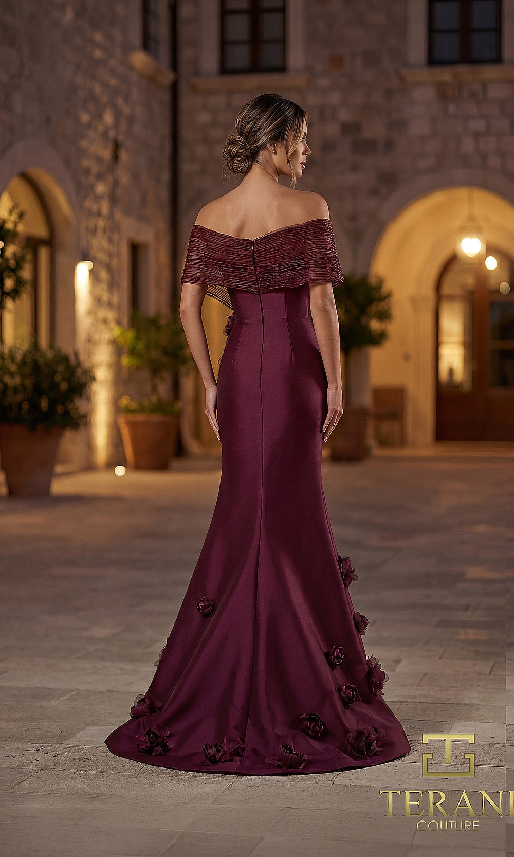 Terani Couture 262E7070 Wine formal evening dress back view with off-shoulder pleated neckline, satin fitted column, 3D rosettes at hem, gala gown