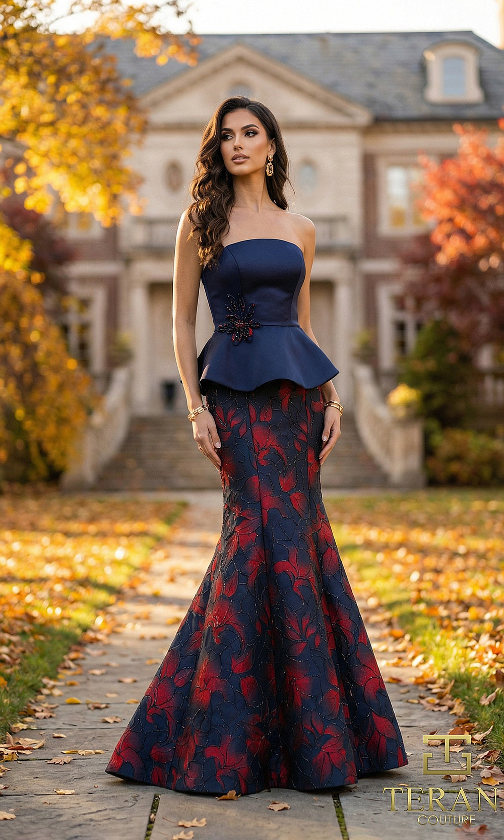 Terani Couture 262E7075 Navy Red formal evening dress front view with strapless navy peplum bodice with floral brooch, red floral jacquard mermaid skirt, black tie event dress