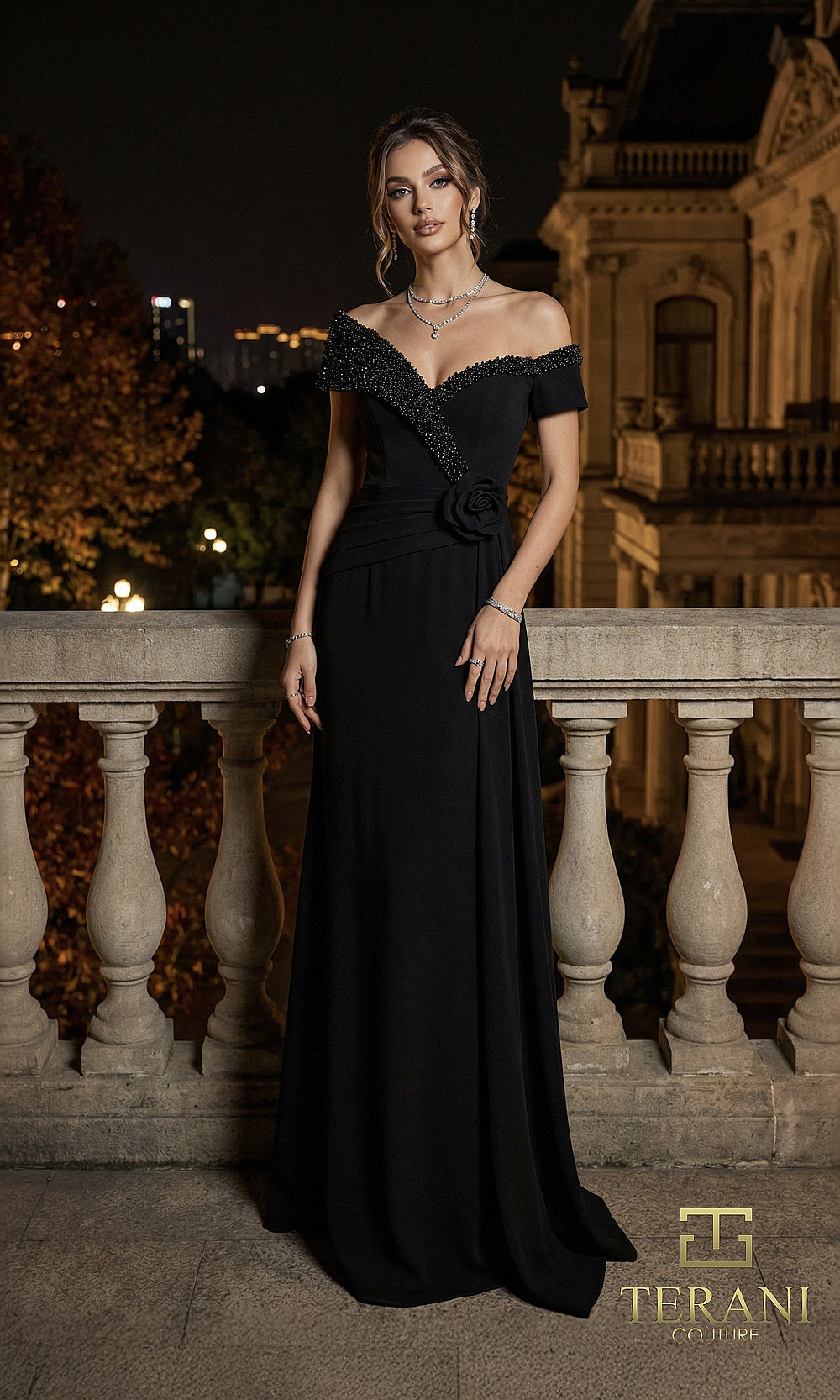 Terani Couture 262E7122 Black formal evening dress front view with off-shoulder V-neck with beaded lapel trim and rosette, crepe column gown, black tie event dress