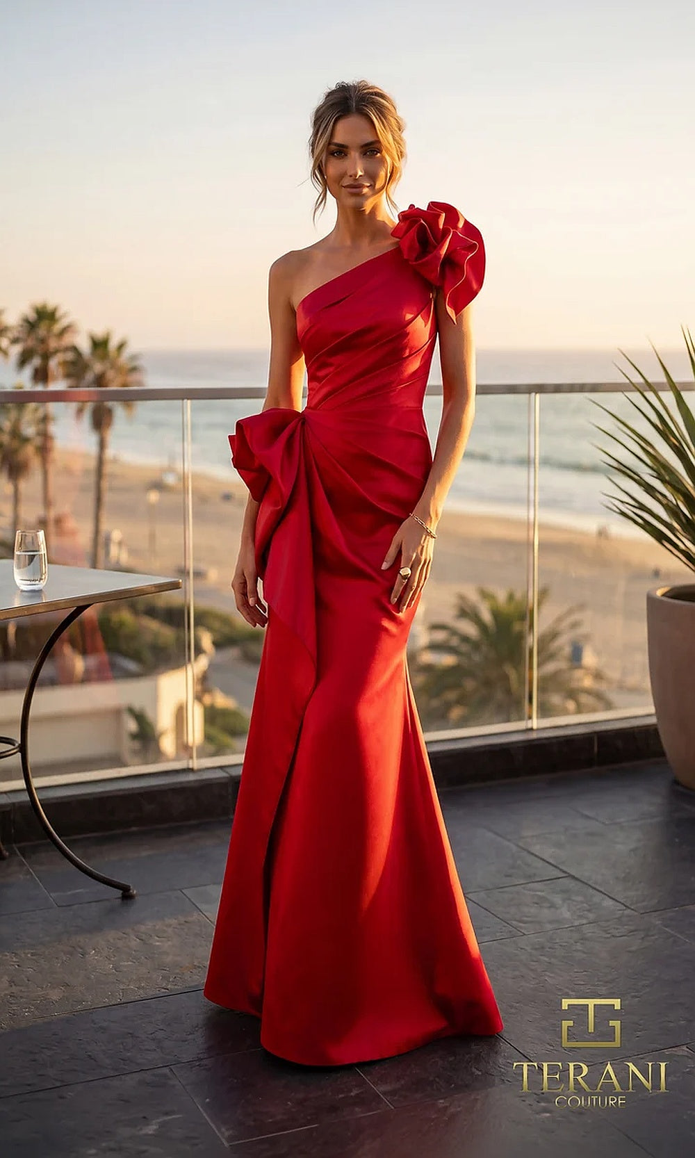 Terani Couture 262E7132 Red formal evening dress front view with one-shoulder ruffle bow neckline, ruched satin column with sculpted side bow, evening gown