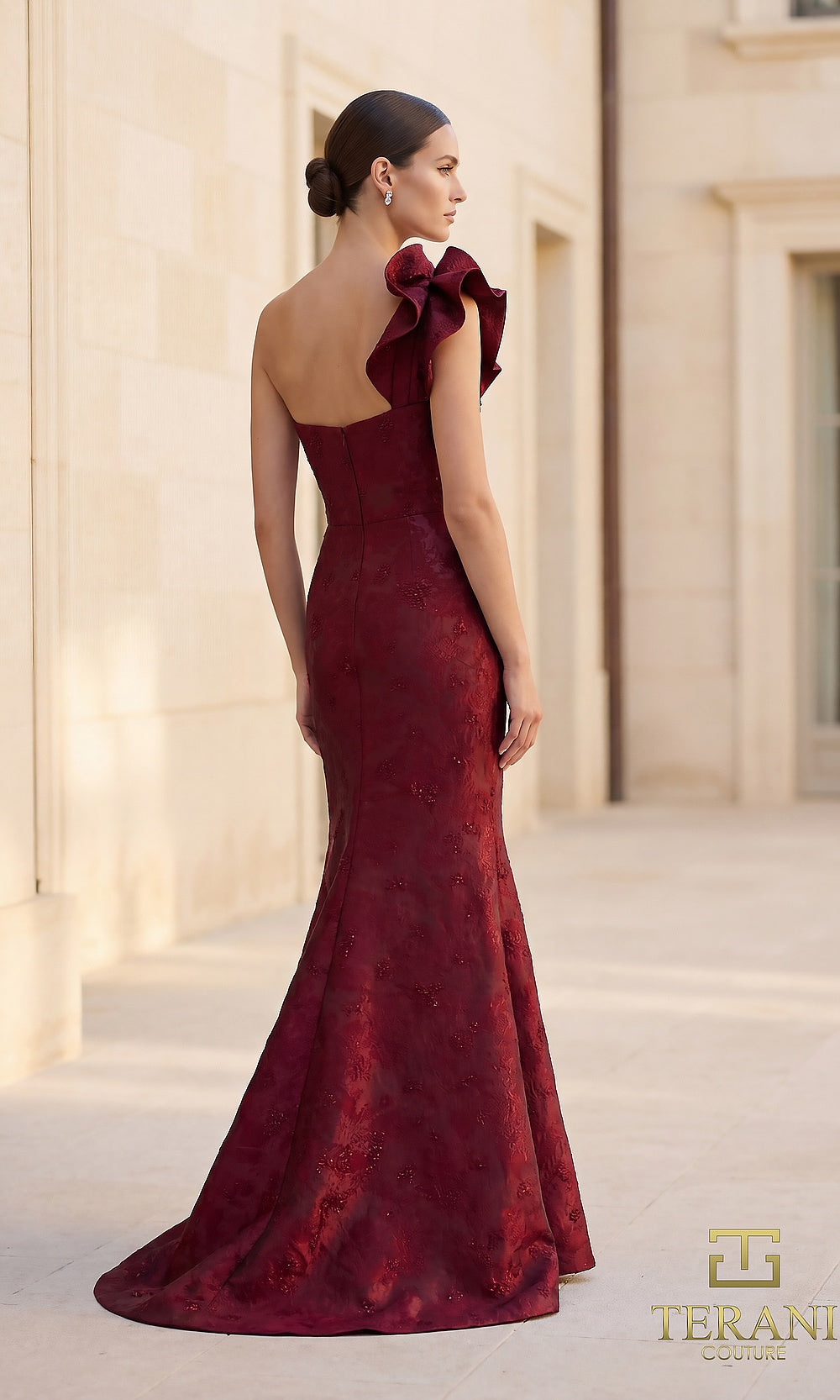 Terani Couture 262E7136 Merlot formal evening dress back view with one-shoulder ruffle jacquard mermaid, flared train, gala gown