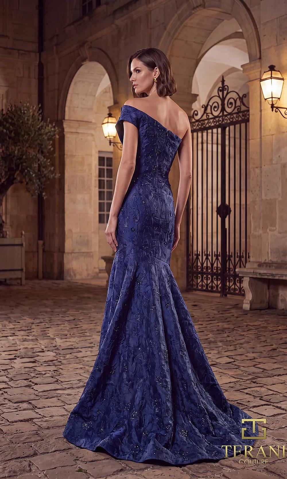 Terani Couture 262E7137 Midnight formal evening dress back view with off-shoulder metallic brocade mermaid, flared train, evening gown