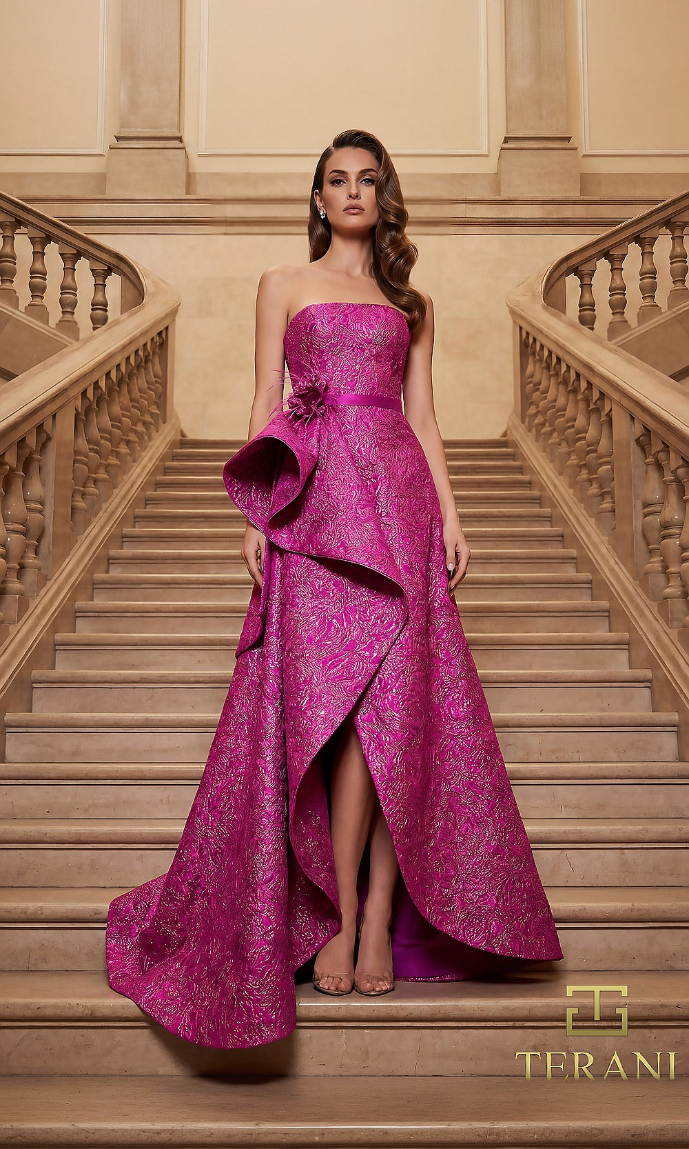 Terani Couture 262E7355 Fuchsia formal evening dress front view with strapless straight neckline, metallic jacquard gown with sculptural cascading ruffle and front slit, black tie event dress