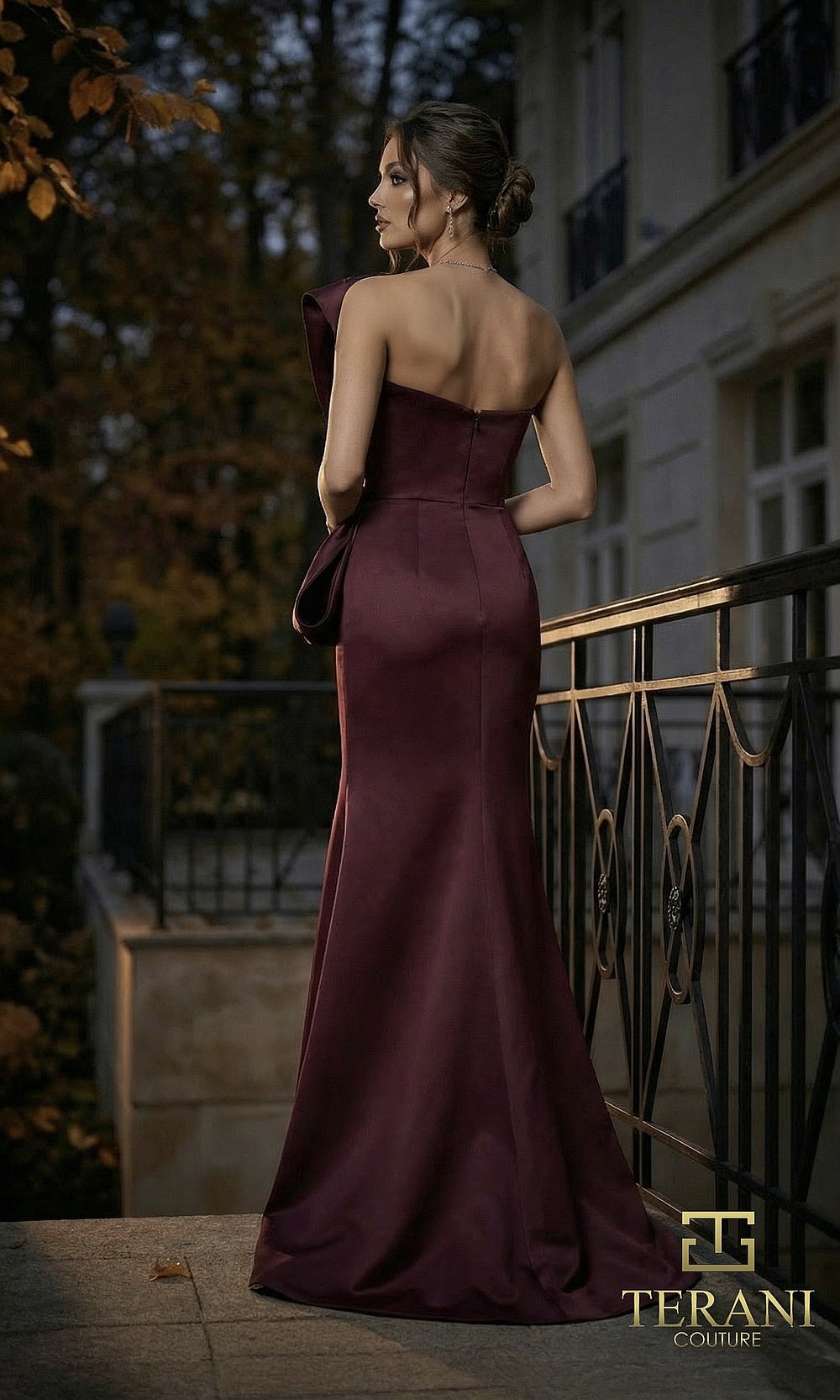 Terani Couture 262E7358 Wine formal evening dress back view with asymmetric satin fitted column, sculpted bow drape, gala gown