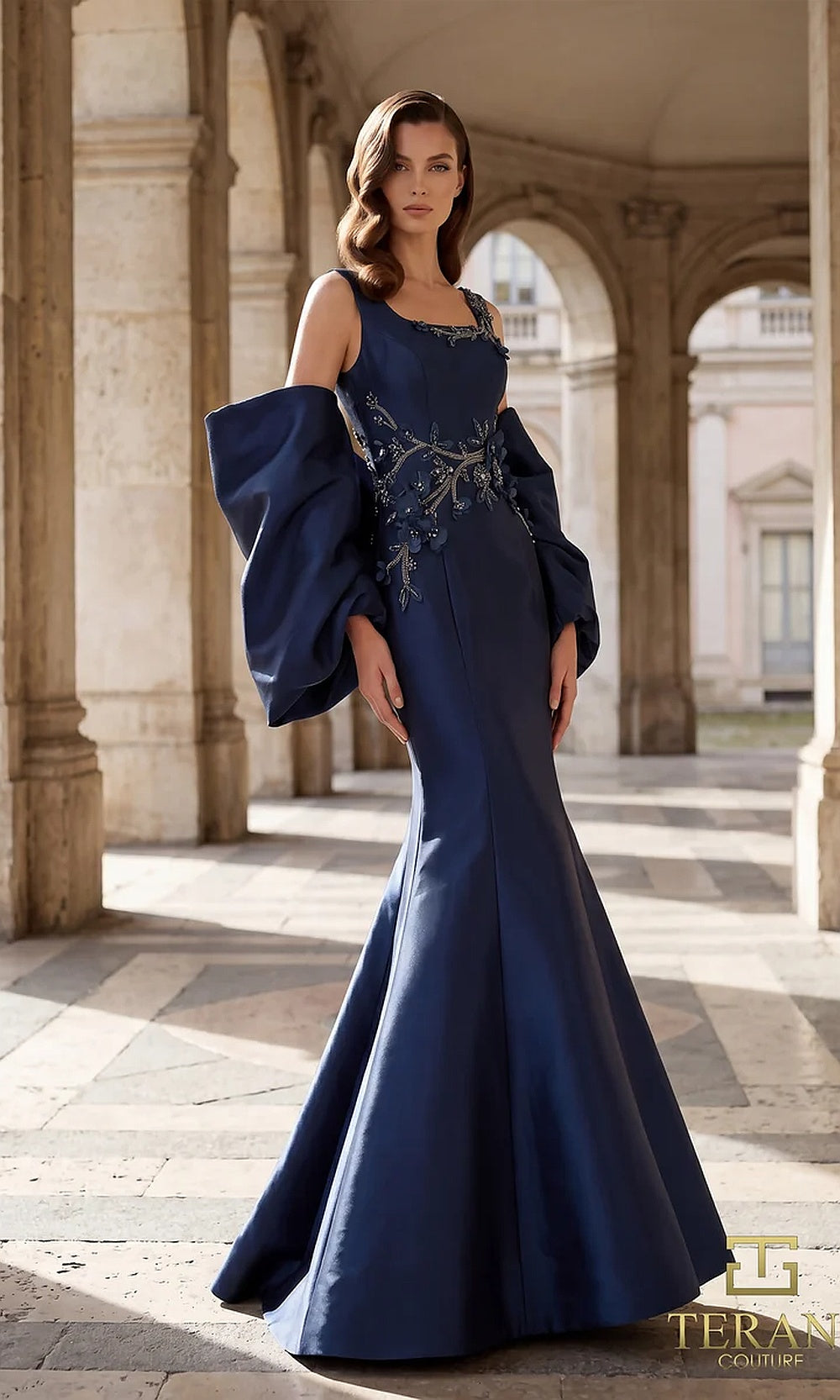 Terani Couture 262M7253 Navy mother of the bride dress front view with jewel neckline, detached bishop sleeves, beaded floral appliqué mikado mermaid, mother of the bride styling