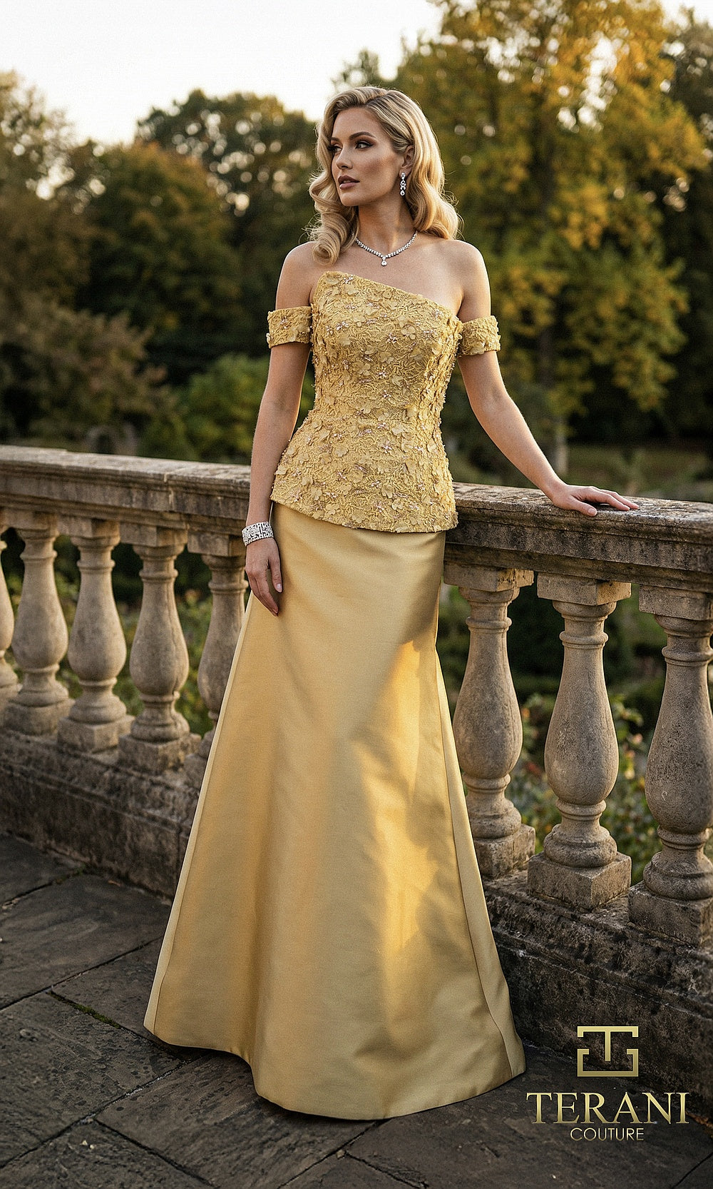Terani Couture 262M7270 Gold mother of the bride dress front view with off-shoulder beaded lace peplum bodice, satin fitted skirt, mother of the bride styling