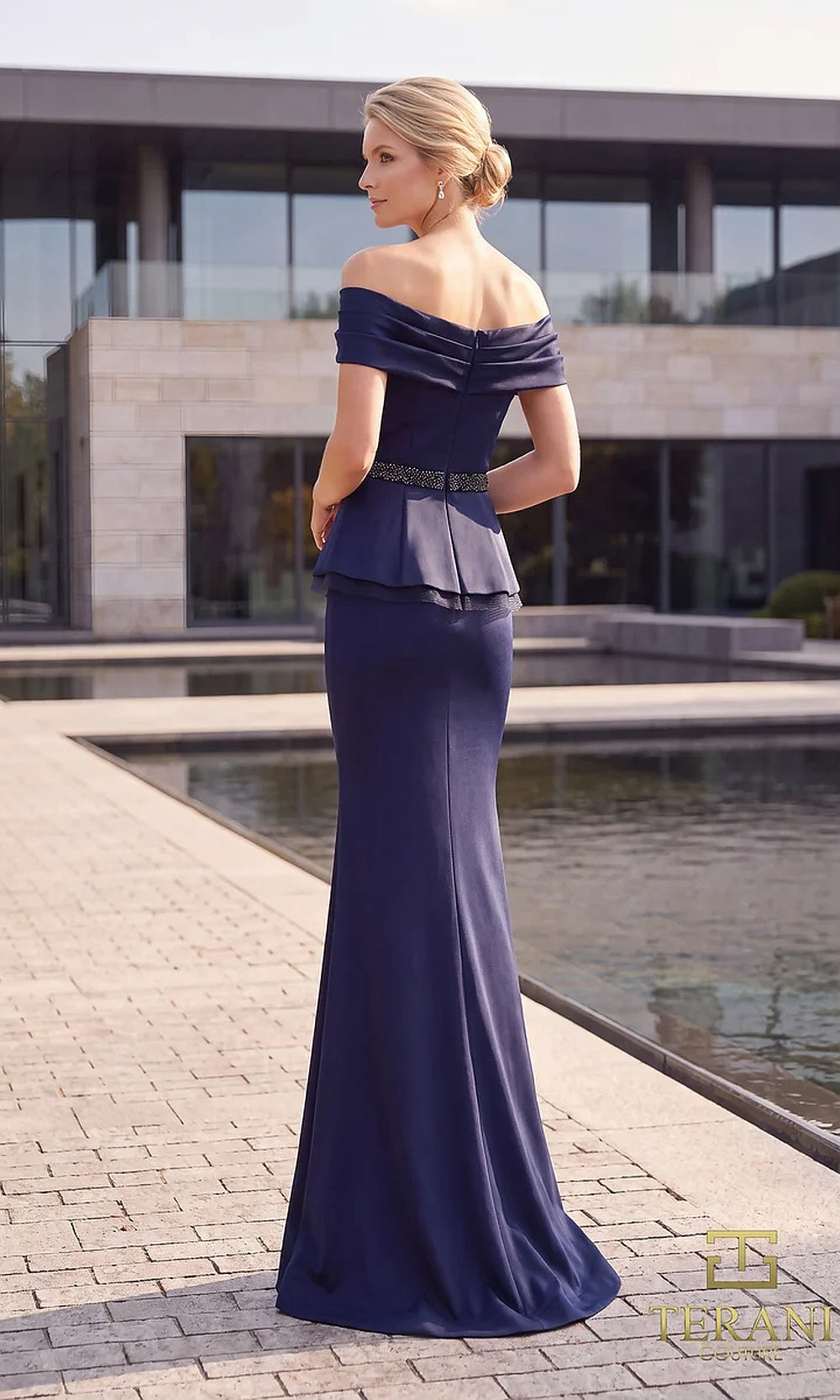 Terani Couture 262M7279 Navy mother of the bride dress back view with off-shoulder pleated neckline, beaded belt, peplum crepe mermaid, formal wedding celebration dress