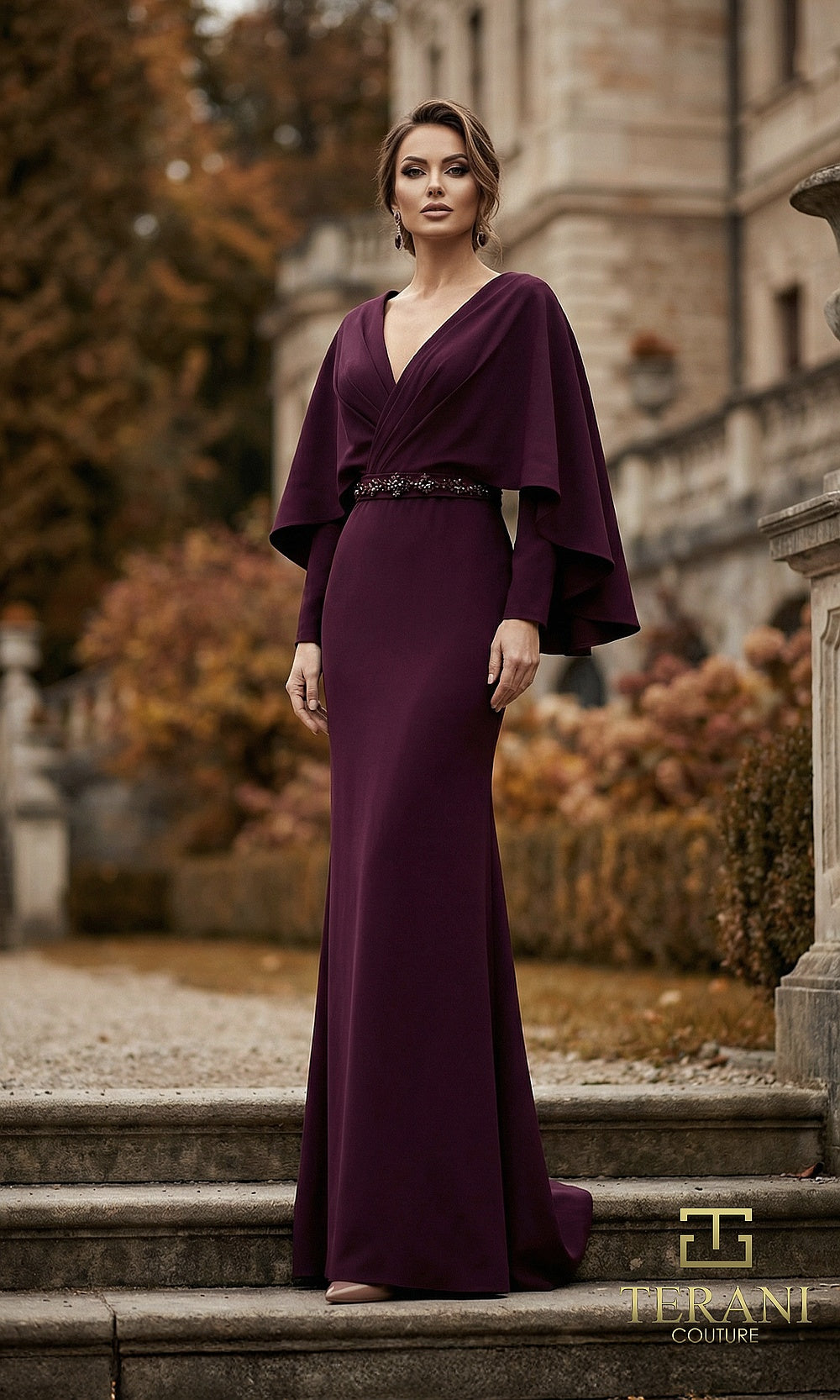 Terani Couture 262M7295 Aubergine mother of the bride dress front view with deep V-neck crepe column with attached cape sleeves and beaded belt, mother of the bride styling