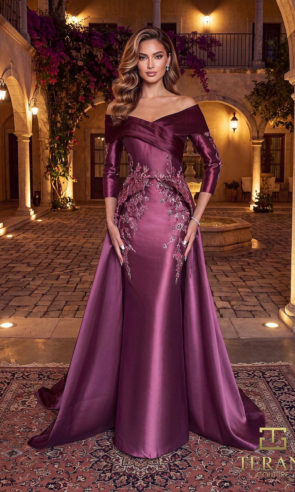 Terani Couture 262M7315 Mauve Wine mother of the bride dress front view with off-shoulder crossover neckline, three-quarter sleeves, beaded appliqué satin column with overskirt, mother of the bride styling