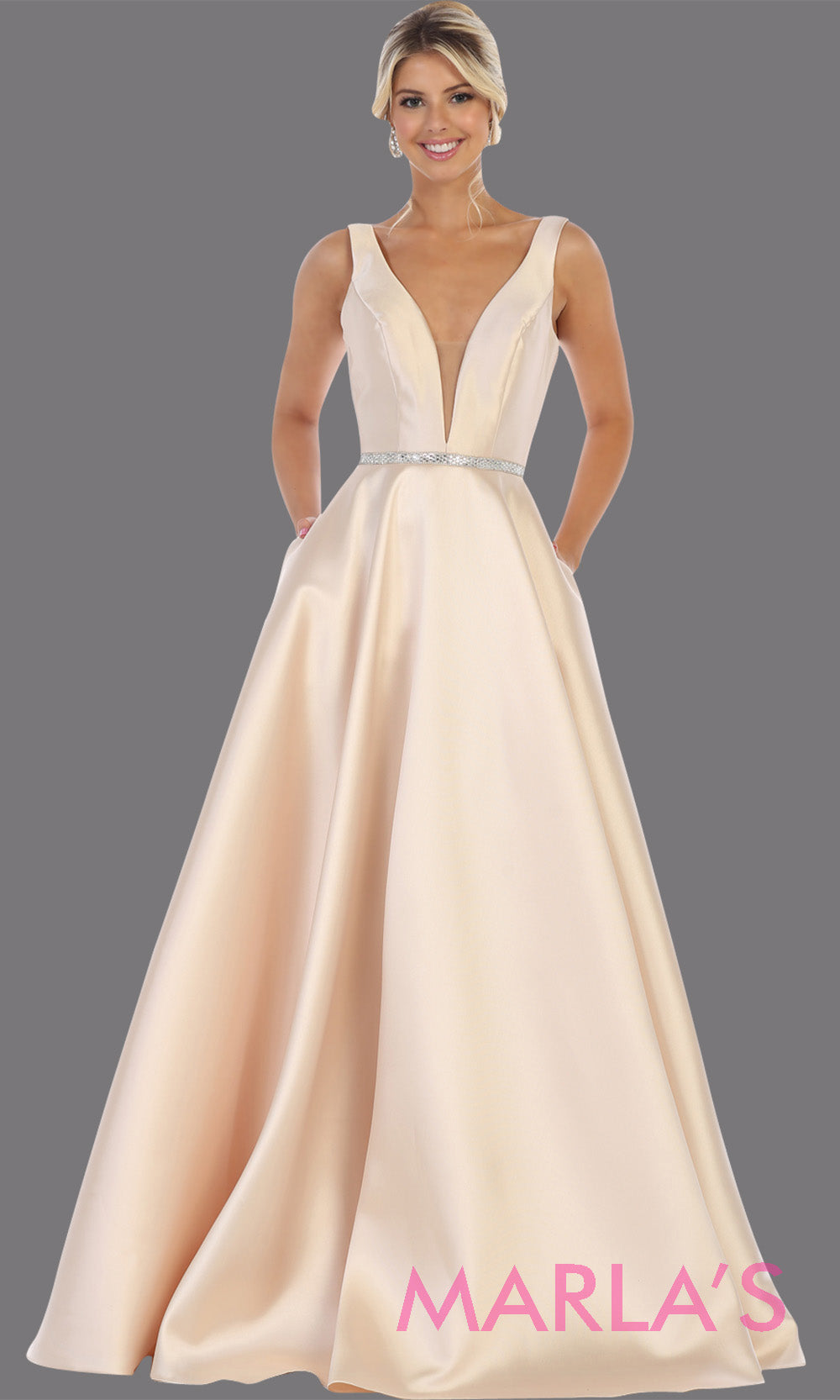 Long simple v neck champagne semi ballgown with pockets. This light gold flowy gown from mayqueen is perfect for prom, black tie event, engagement dress, formal party dress, plus size wedding guest dresses, bridesmaid, indowestern party dress