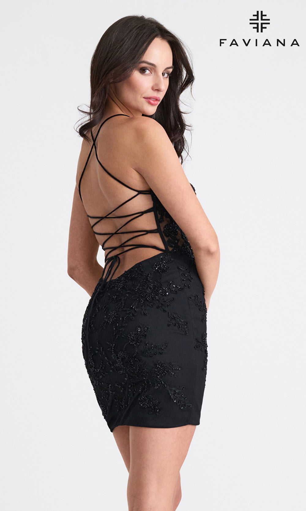 Woman wearing a black dress with lace-up back, brand 'Faviana' visible