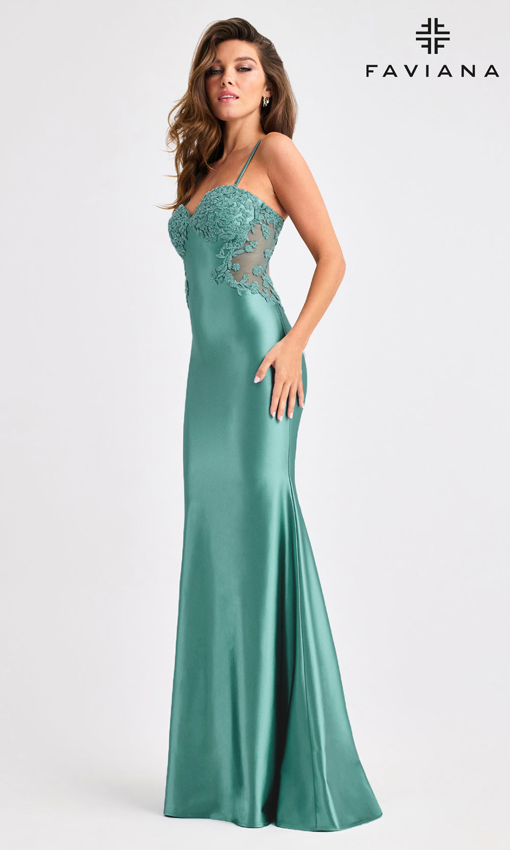 Teal evening gown with lace detailing on a white background, featuring the Faviana brand.