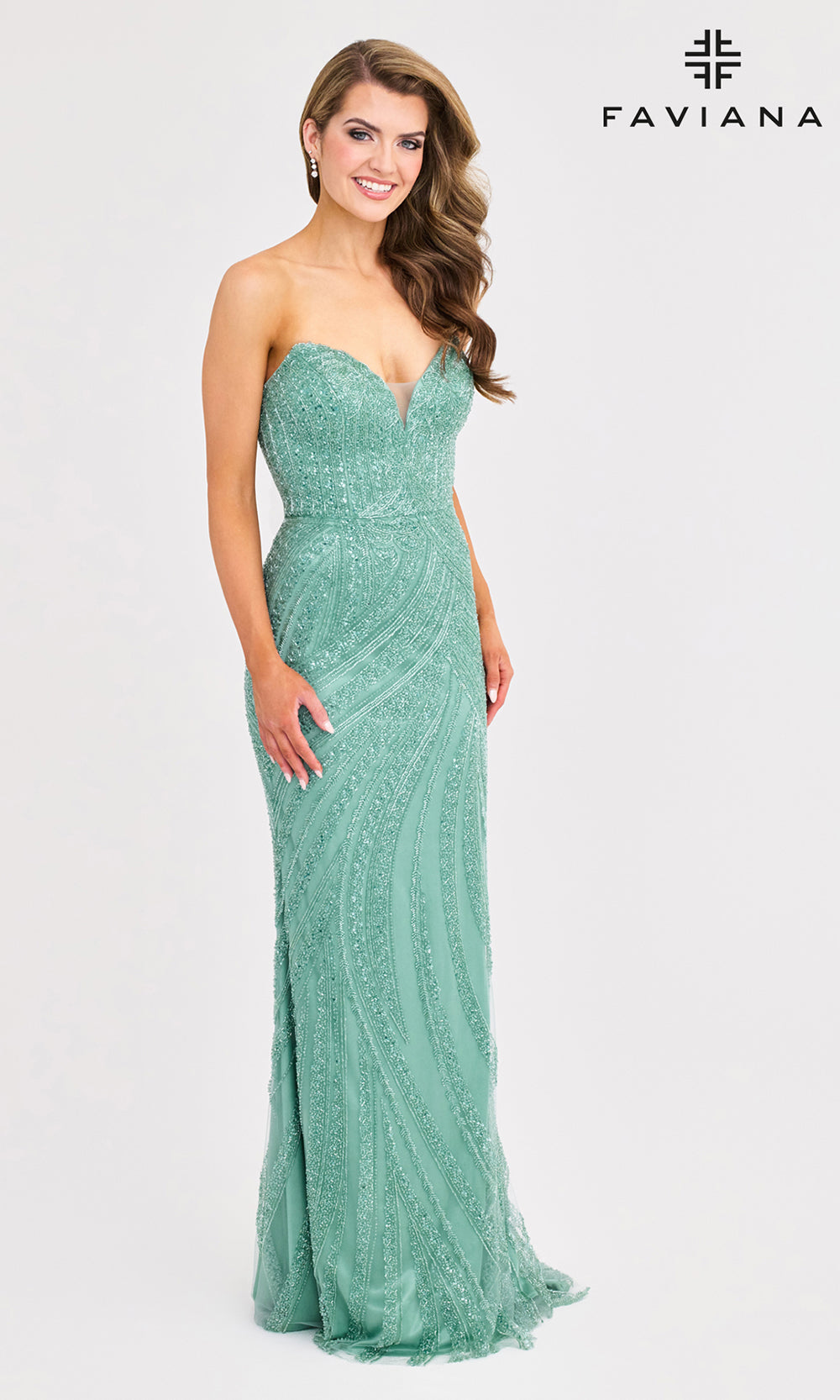 Woman wearing a strapless green evening gown with Faviana branding on a white background
