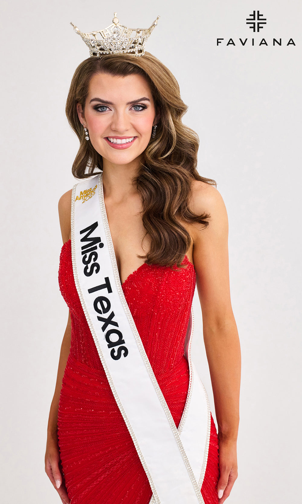 Woman in a red dress with a 'Miss Texas' sash and a crown, on a white background with Faviana branding.